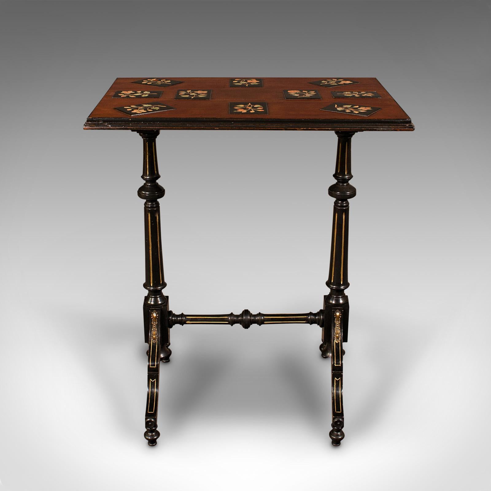 This is an antique specimen table. An English, mahogany and marble inlaid occasional table with Aesthetic period taste, dating to the Victorian era, circa 1880.

Fascinating inlaid top over a wonderfully Gillows-esque base
Displays a desirable