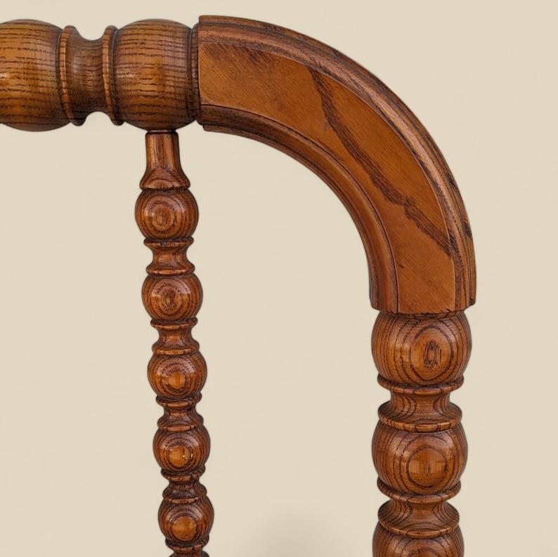 Antique Spindle Headboard, Queen Size, 19th Century, Solid Oak, Victorian Style, Turned Wood Spindles

This spindle headboard is a classic and timeless piece of furniture that adds a touch of elegance to any bedroom. Made of solid oak wood, the