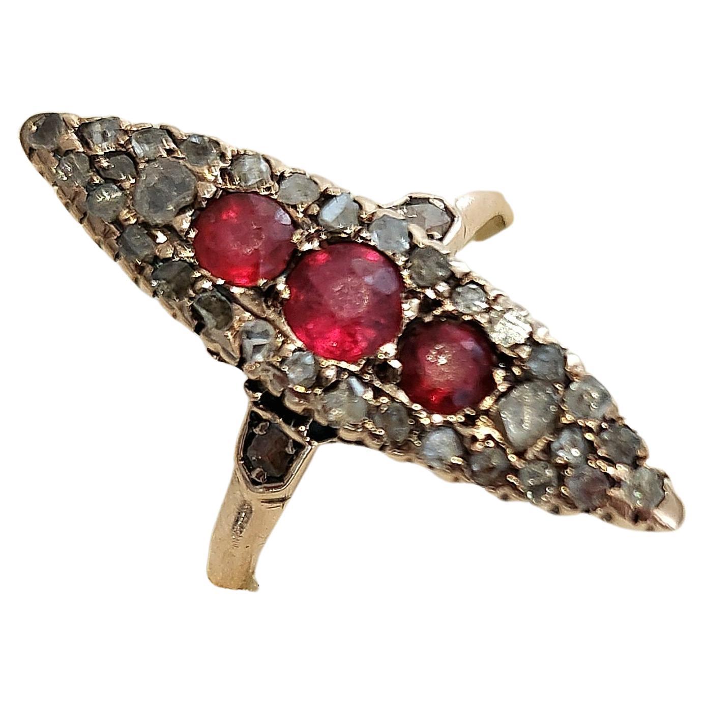 Antique imperial russian era 1889/1900.c ring centered with 3 natural spinel rubies blood color flanked with rose cut diamonds ring was made in moscow between 1889/1900.c tsarist era hall marked 56 imperial russian gold standard and moscow assayer