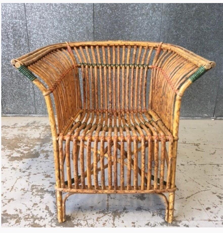 Antique split tiger cane occasional chair with fanned arms
vibrant color and pattern through cane,
circa 1920s.