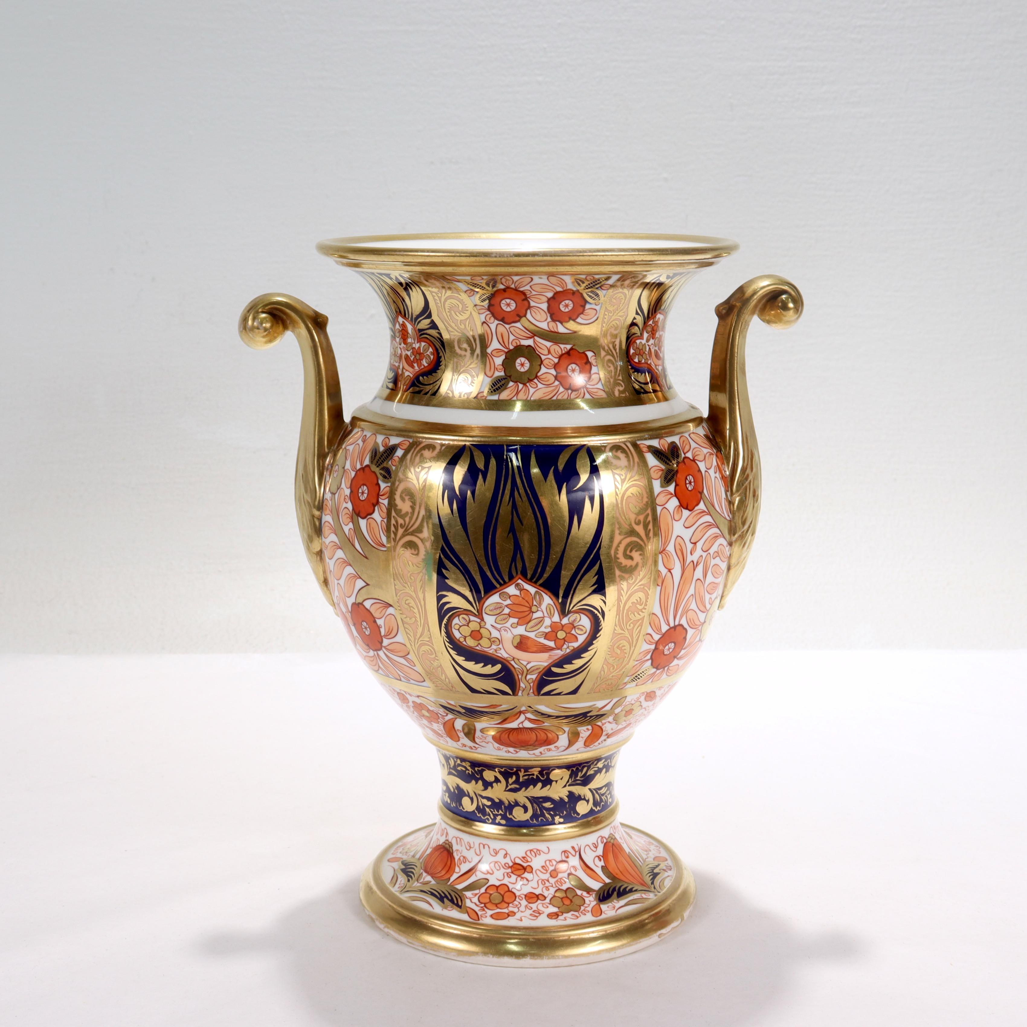A fine antique English Imari porcelain vase.

By Spode.

Pattern no. 1409.

With cobalt blue, iron red, and gilt decoration throughout, prominent in the decoration are treffoil reserves with birds on a limb which is a hallmark of this