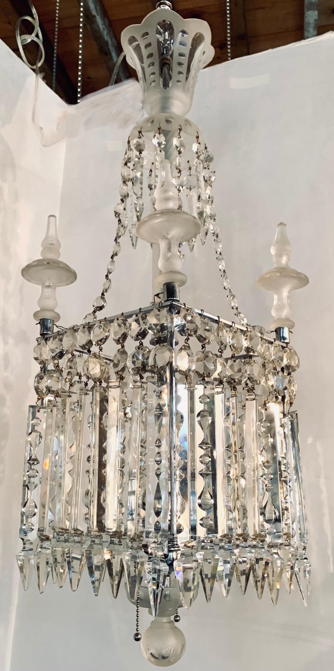 Stunning chandelier features a cube shaped body with frosted etched glass spires and long dangling crystals on all four sides. Takes two bulbs. Wired and in working condition.