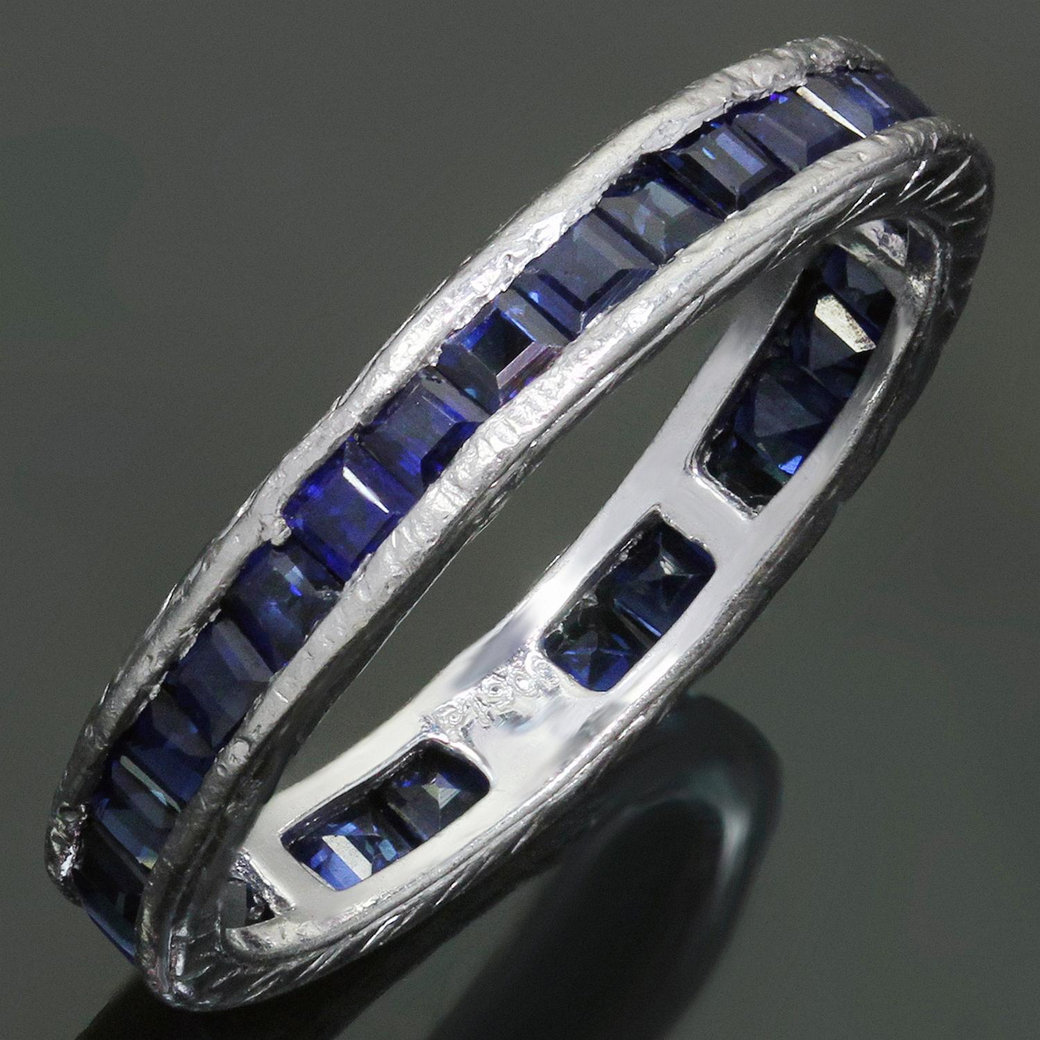 This classic antique eternity band is hand-engraved in platinum and set with square-cut blue sapphires. Made in United States circa 1930s. Measurements: 0.11