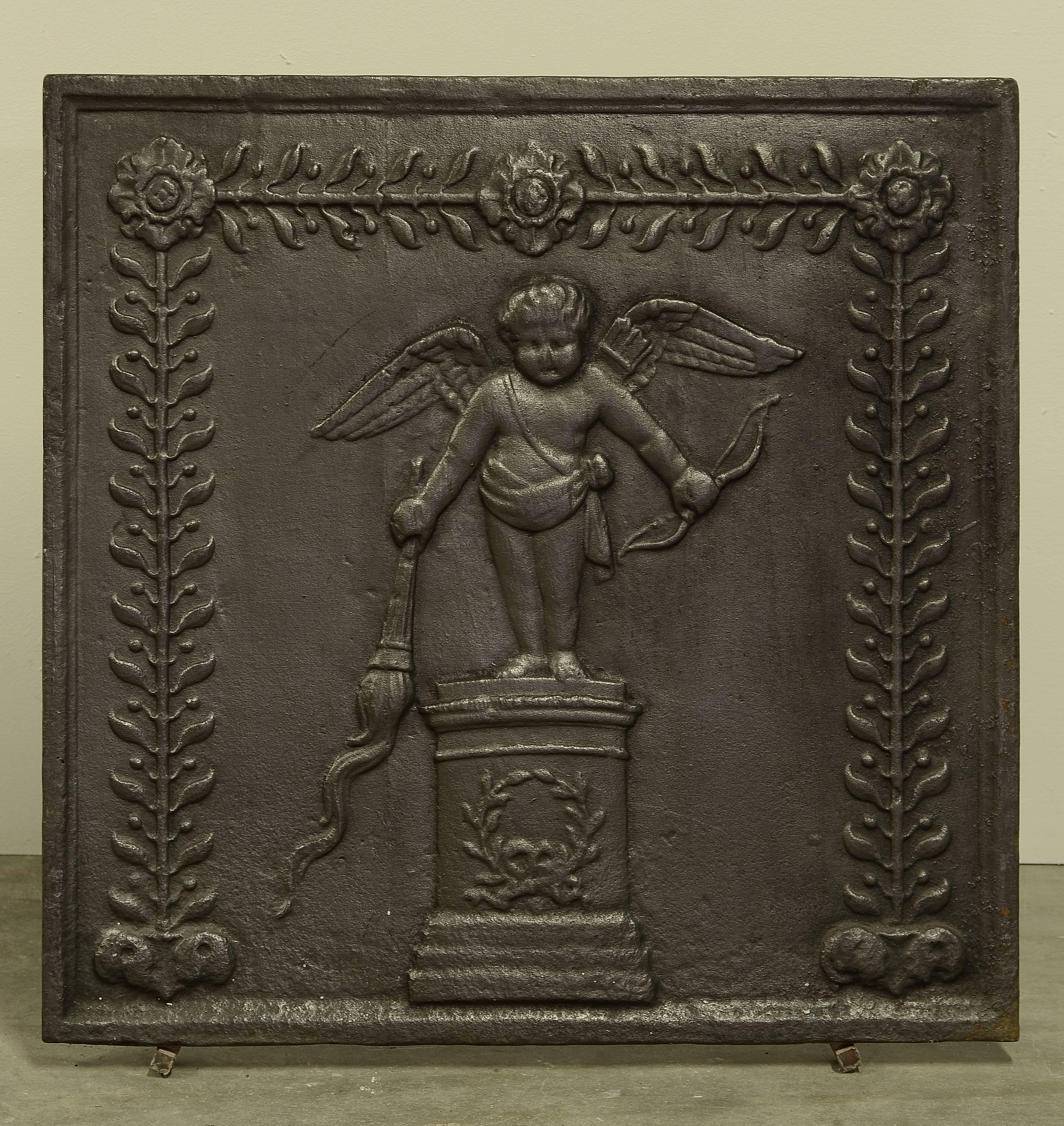 Sharp cast iron fireback displaying cupid with a bow and torch, very decorative.
19th century, France.

Great usable size and excellent condition. 
To be used in a fireplace or as a backsplash.
Can be supplied with stand.