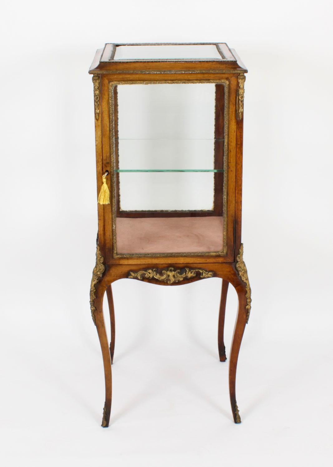 This is an exquisite antique French bois violette  vitrine of square shaped form with glazed sides and fabulous ormolu mounts, circa 1880 in date.

This cabinet is elegantly crafted from fabulous bois violette, otherwise known as violetwood with