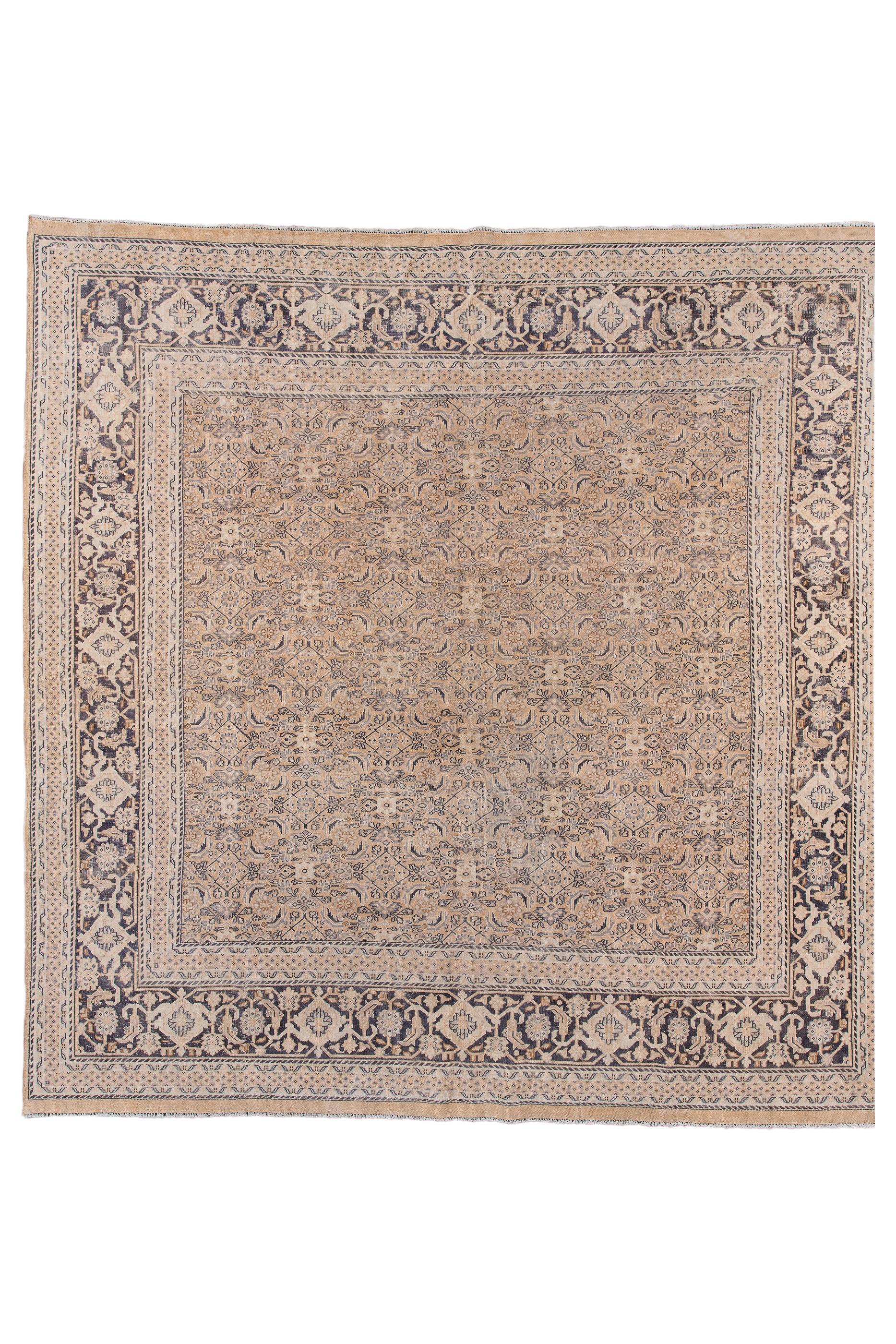 This “Turkish Tabriz” shows a perfectly balanced small, allover Herati design on a buff field, set off by a symmetric reversing turtle main border on a dark ground. Outer minor trimmed at the sides and is intact at the ends. Cotton foundation.