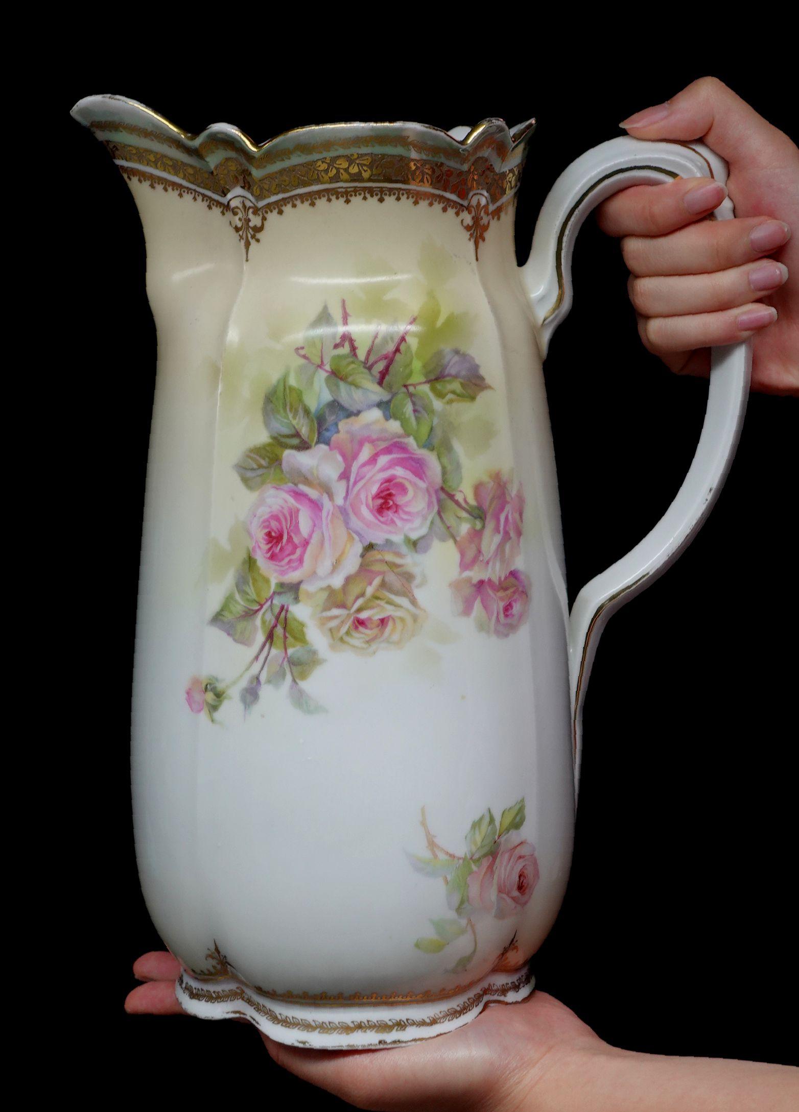 A wonderful antique S&T RS Germany large Tankard absolutely 100% hand-painted floral roses in the multi-colored pink, purple, red, and rich green leaves, delicate arrangement of the composition, more in some places but less in opposite locations.