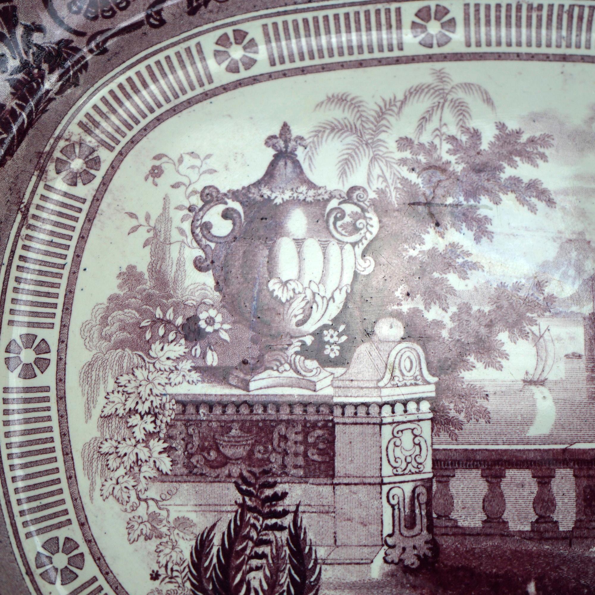 An antique Staffordshire mulberry transferware platter by E. W. & S. offers porcelain construction in Etruscan Vase pattern, maker mark en verso as photographed, 19th century

Measures - 1.5'' H x 15.25'' W x 13.25'' D.