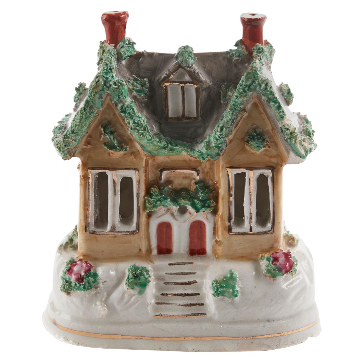Offered for sale is this 19th century antique Staffordshire miniature cottage. A quaint example and a very decorative piece 

It has wonderful colors and is in perfect condition.

  