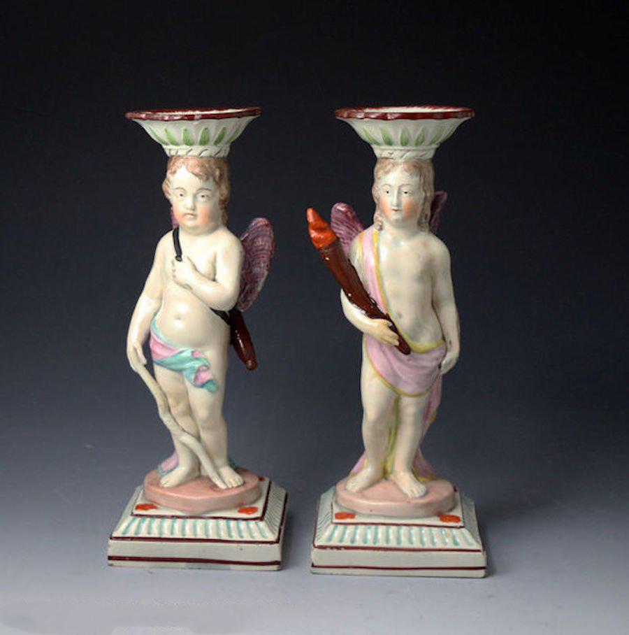 Antique Staffordshire Pottery Candlestick Figures of Cupid and a Putti In Good Condition For Sale In Woodstock, OXFORDSHIRE