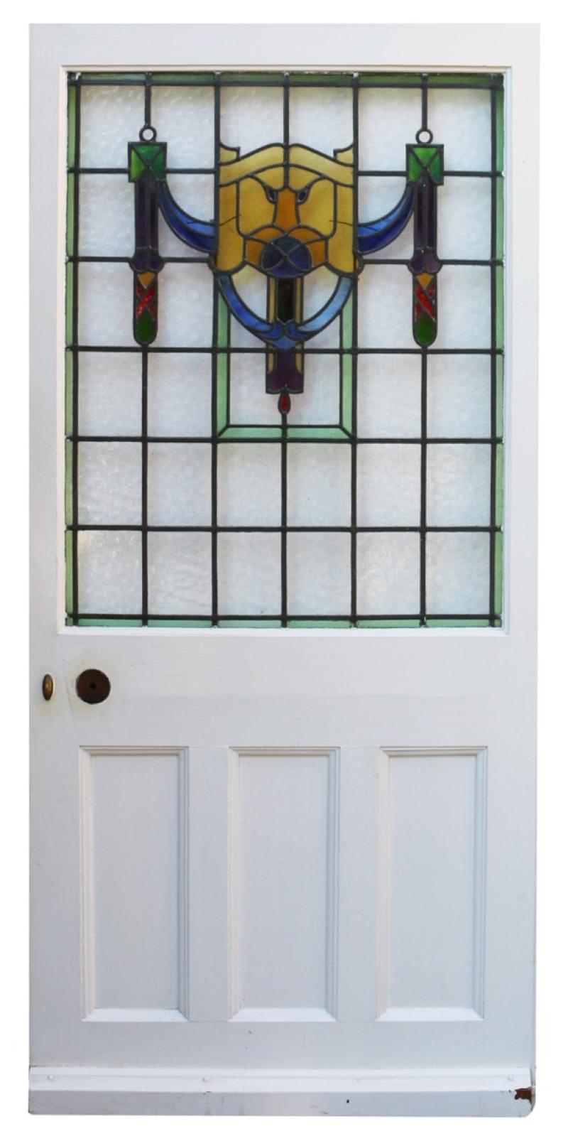 A painted pine door with stained and textured glass.