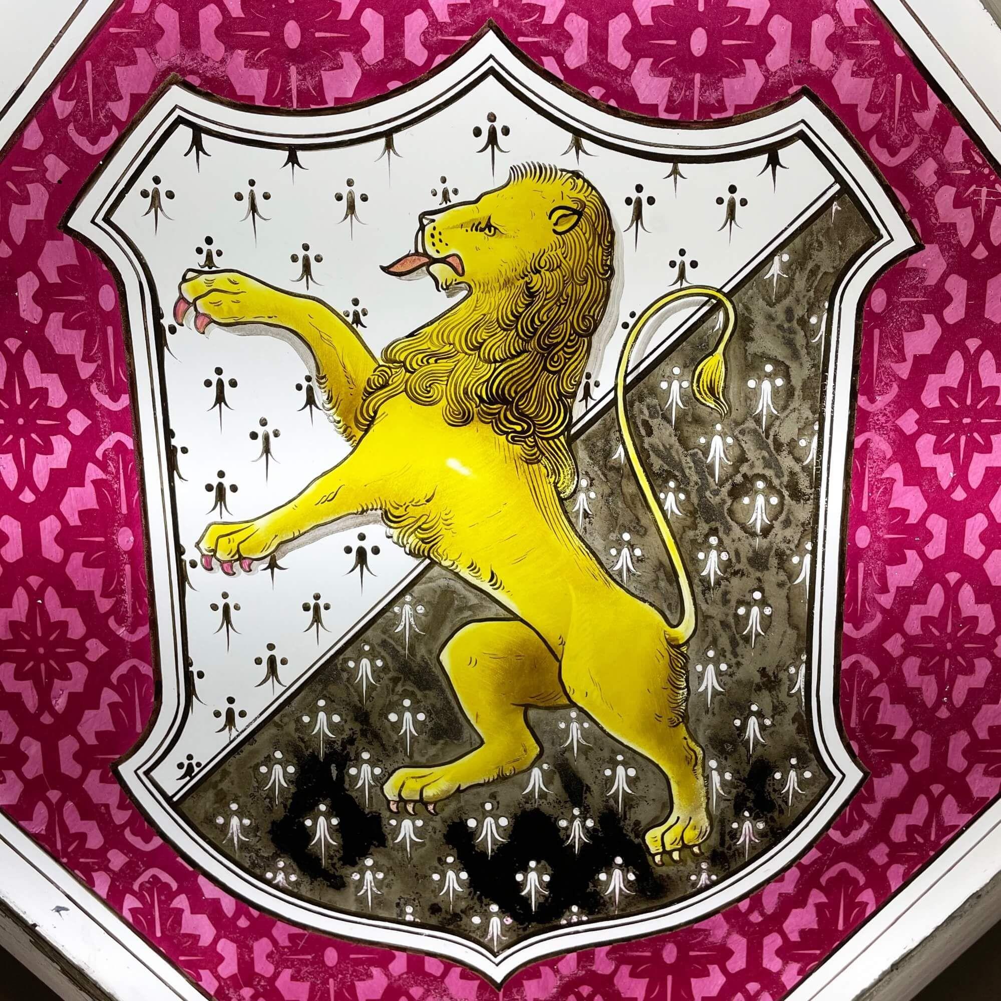 A large antique stained glass window detailed with the armorial crest of the Welsh family of Tudor Trefor, one of a series of 3 we are selling in the same style. At more than a metre square, this window is an impressive piece and features four