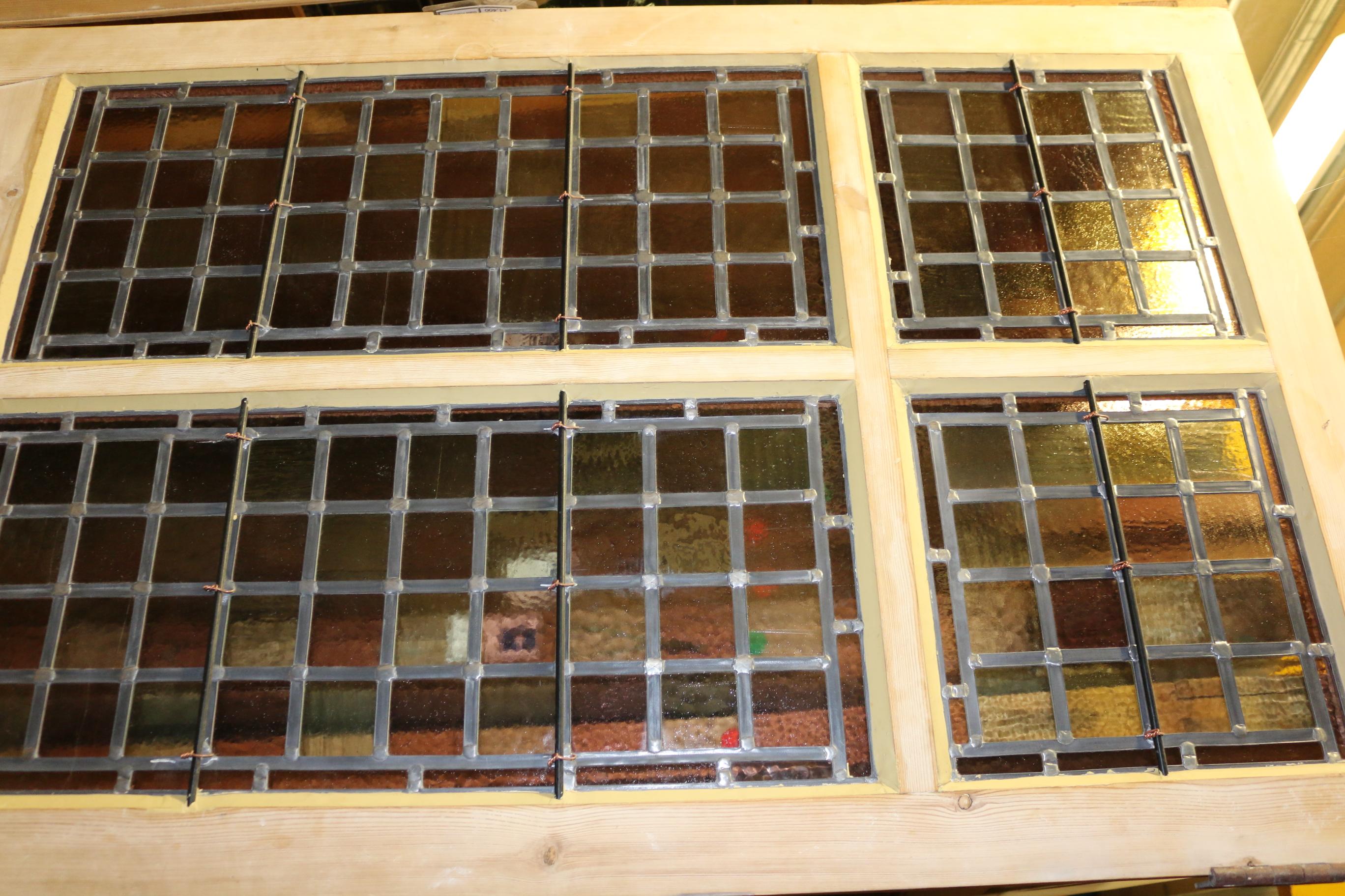 Stripped pine door. The glass fully re built by Ark Stained Glass.
Please note glass is not insured outside of the UK.