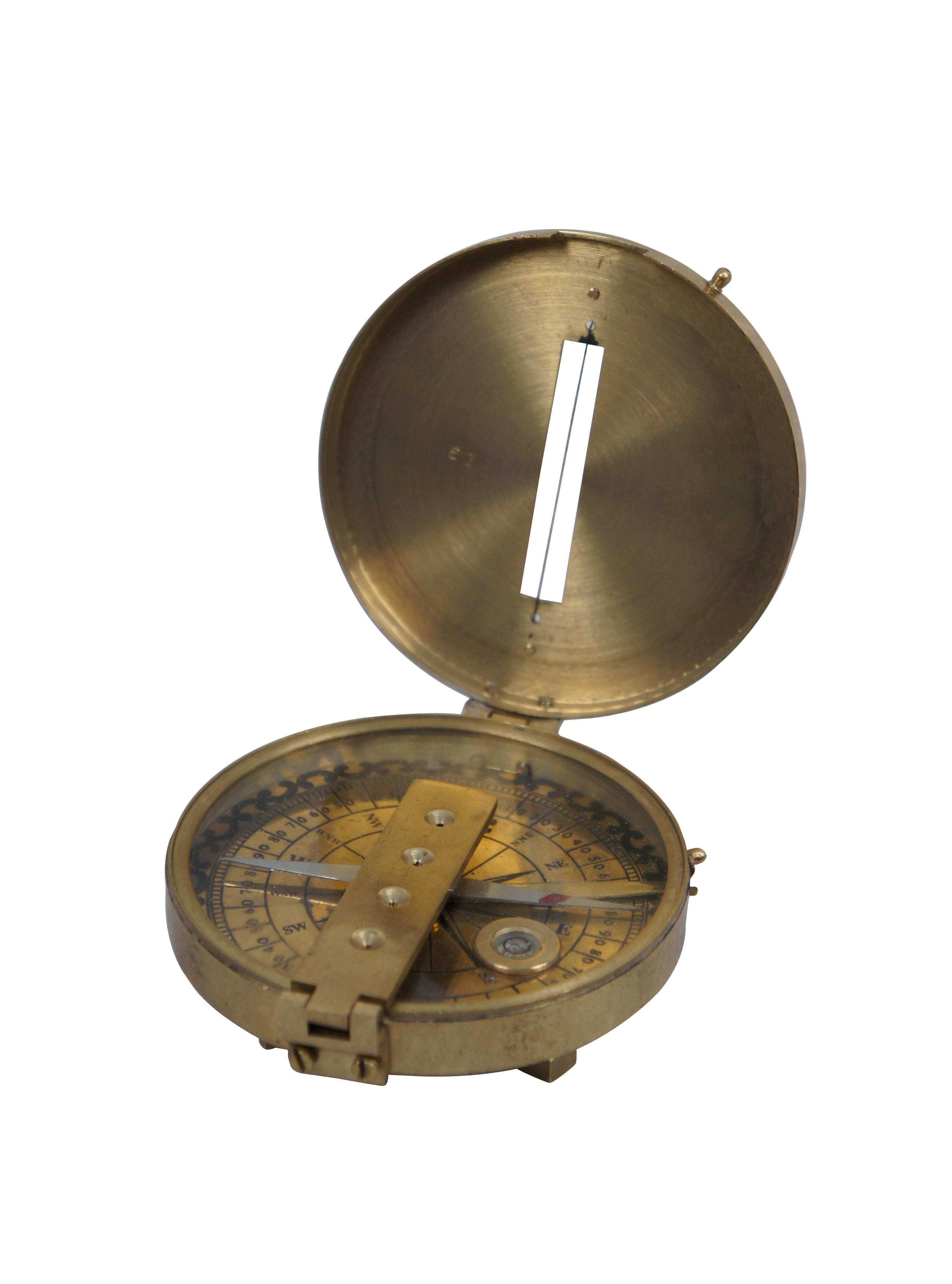 Antique Stanley London surveyors / nautical compass with brass case and face, leveling bubble, folding sightline, and pedestal base for attaching compass to a tripod.

