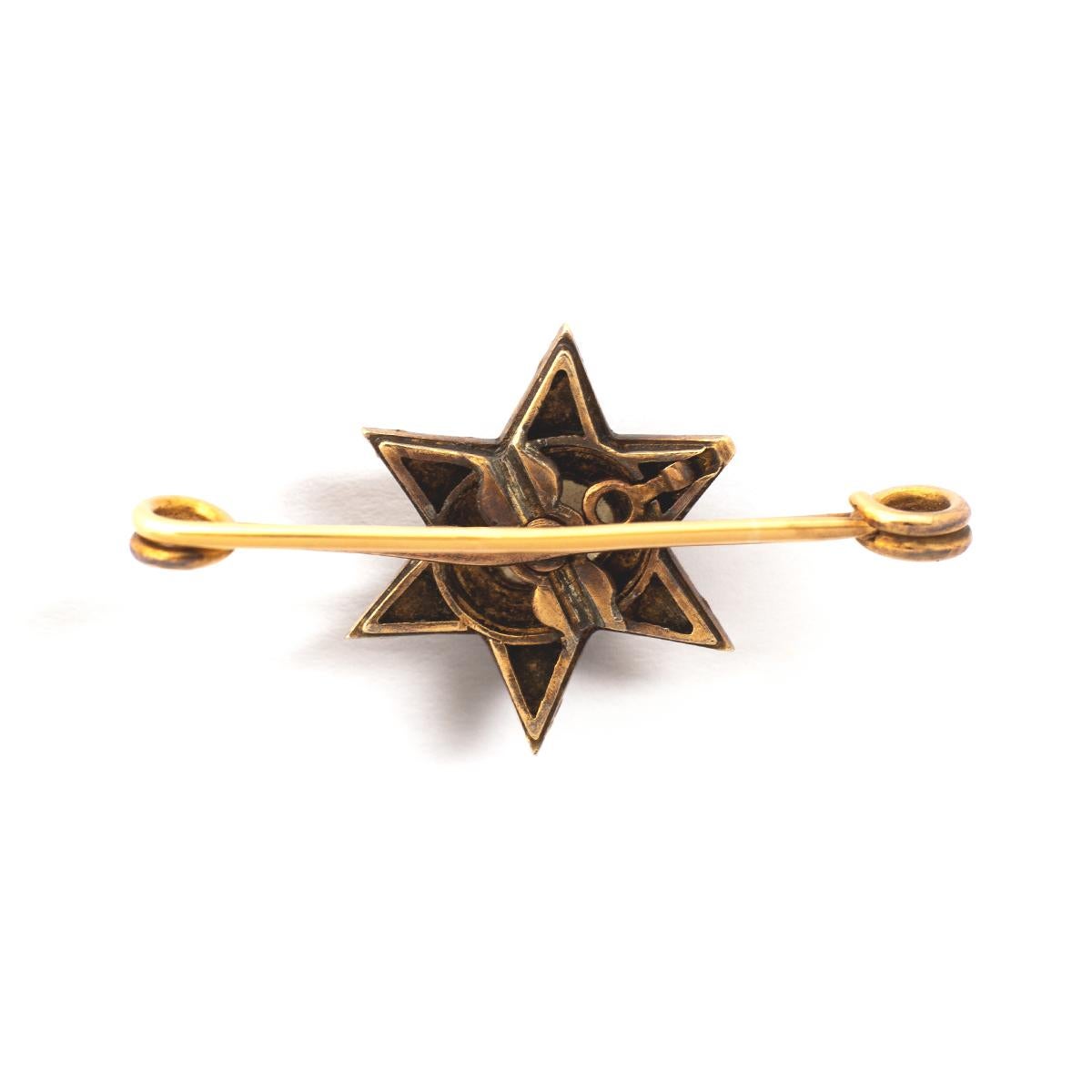 Antique yellow gold Star Brooch set by Rose cut Diamonds and centered by a significant Rose cut Diamond white and clean.
