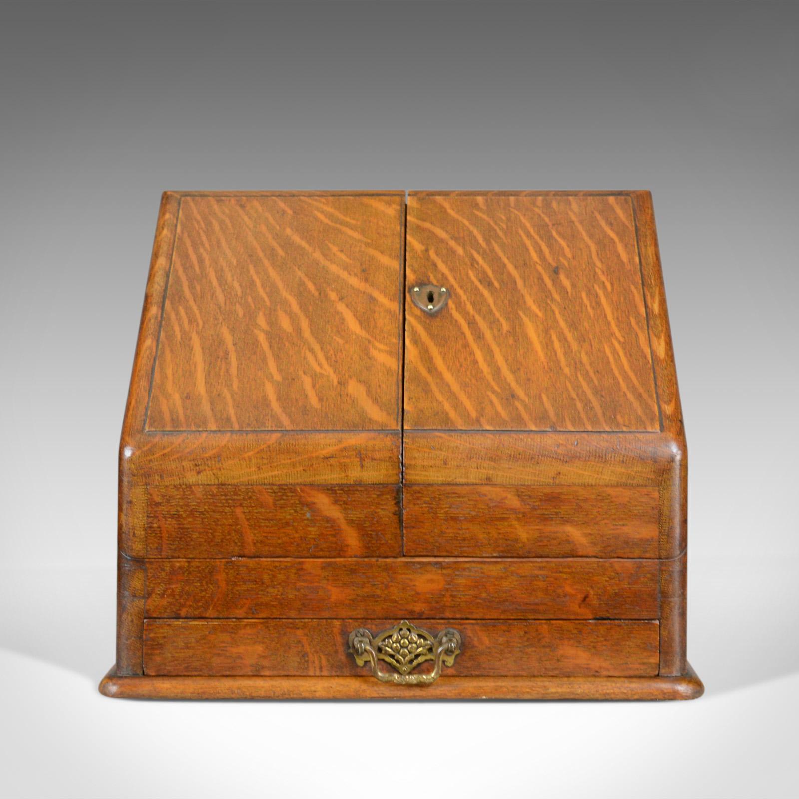 This is an antique stationery cabinet, an English, Victorian, oak correspondence chest dating to the turn of the last century, circa 1900.

Attractive medullary rays in the grain detail of the oak
Good consistent colour in a wax polished