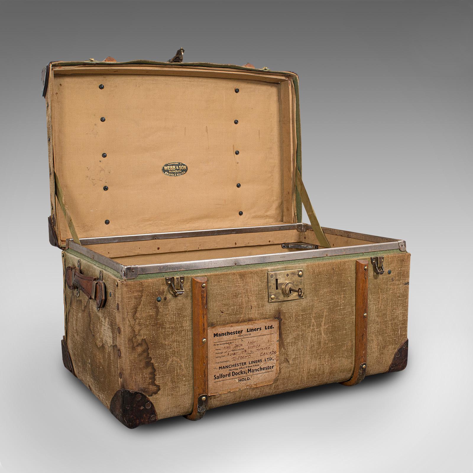 This is an antique steamer trunk. An English, canvas and leather-bound travel chest by Webb & Son, dating to the Edwardian period, circa 1910.

Relive the elegance of the golden age of voyages
Displaying a desirable aged patina with - some water