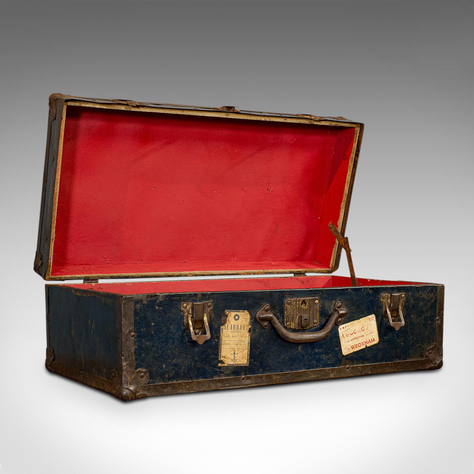 This is an antique steamer trunk. An English, steel travel or voyage chest, dating to the Edwardian period, circa 1910.

From the golden age of long distance travel
Displays a desirable aged patina
Steel panels show pleasing weathering
Fully