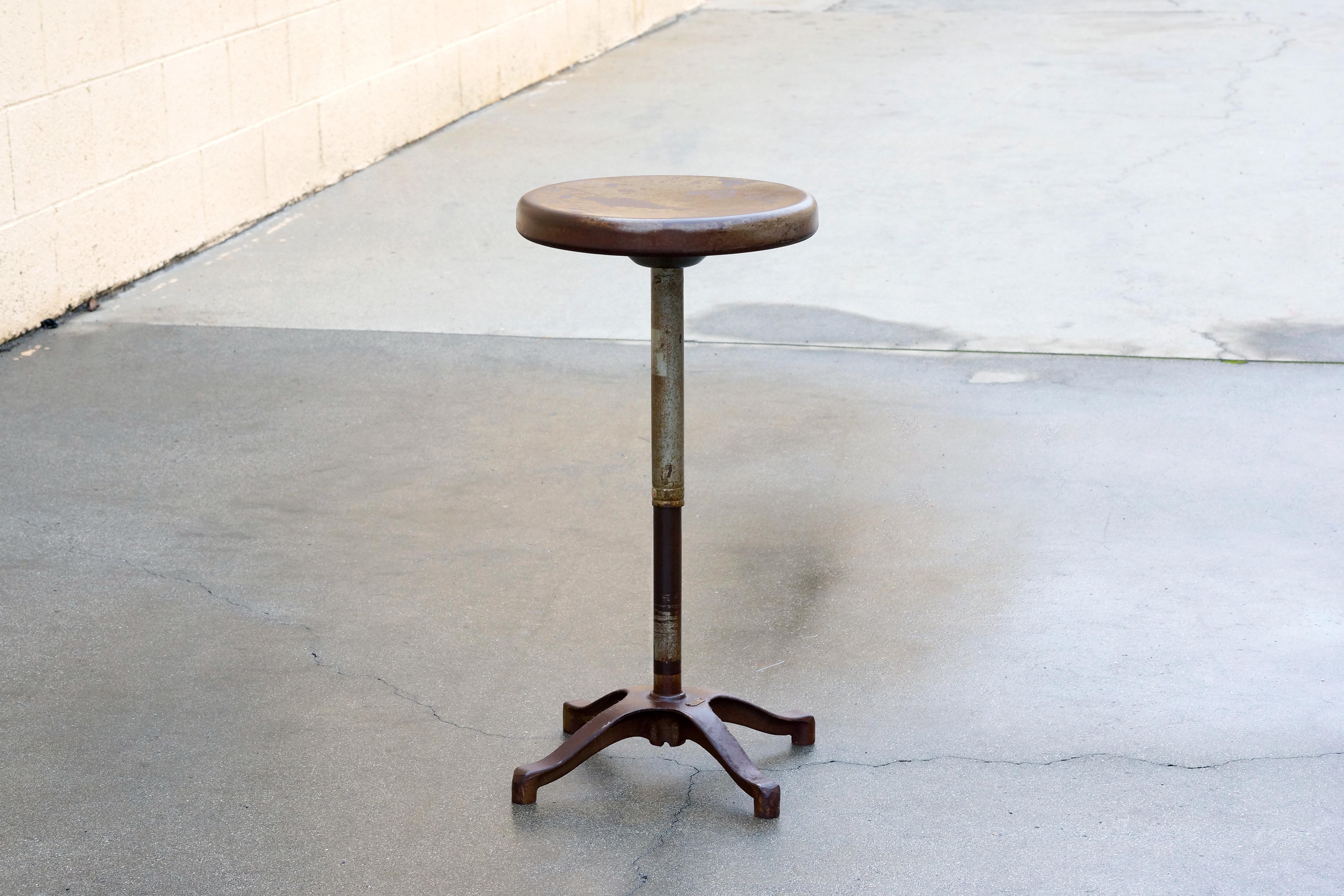Antique steel stool ideal for use as a music stool or drafting stool. All steel with a wonderful distressed patina, lightly clear-coated to maintain variation in finish. 

Dimensions: 13