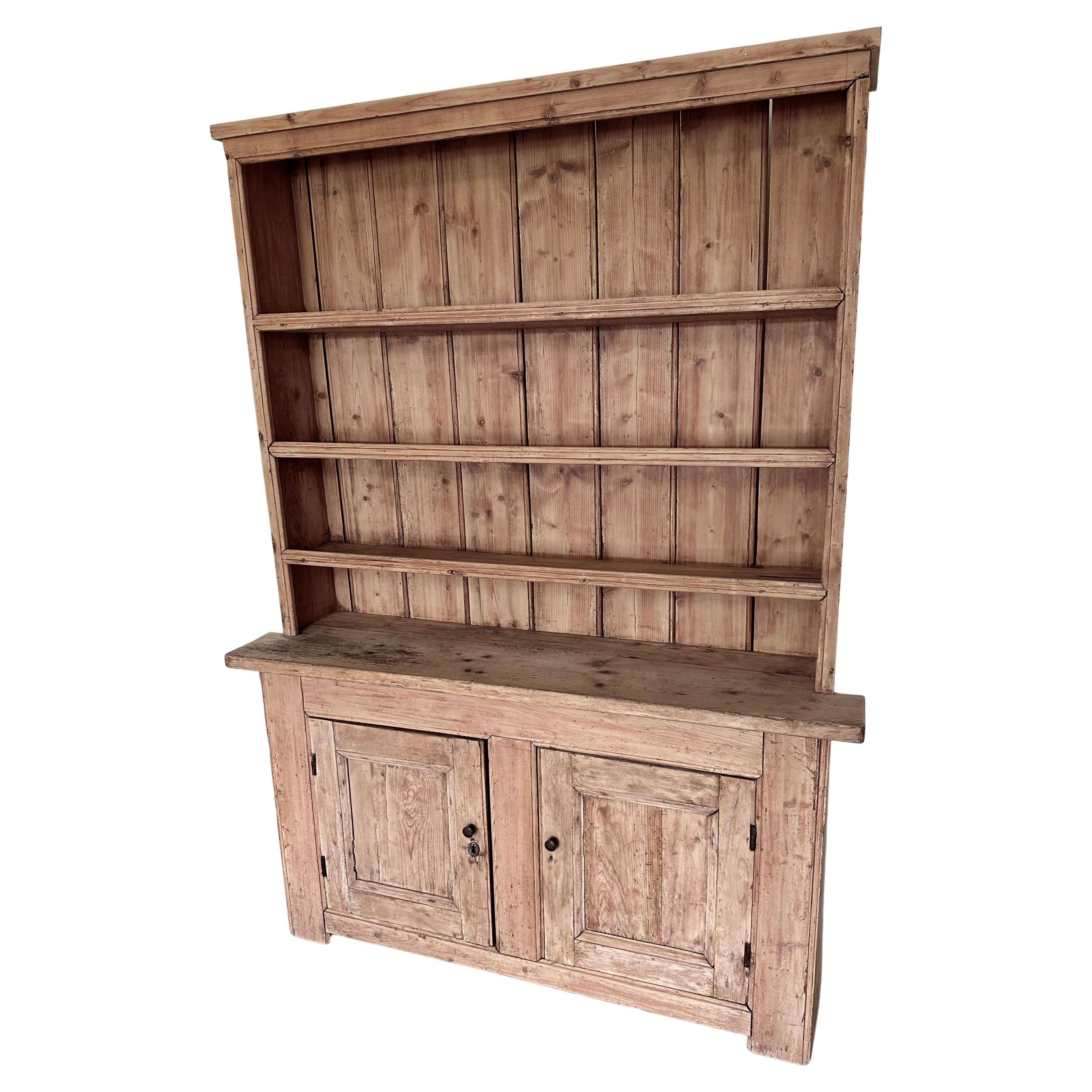 The one piece construction classic country farmhouse style antique pine hutch has wonderful aged patina with plenty of character and charm. Its very narrow 14