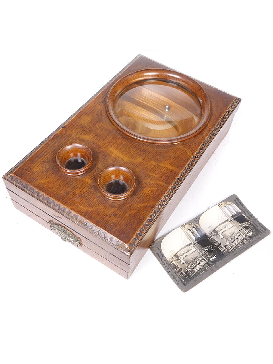 Graphoscope magnifier and stereo Scope/stereo viewer in a beautiful wood case. This elegant design combines the stereo and graphoscope lenses in a single housing, that can be folded up and stowed away when not in use. Year: 1880-1900. Allows for the