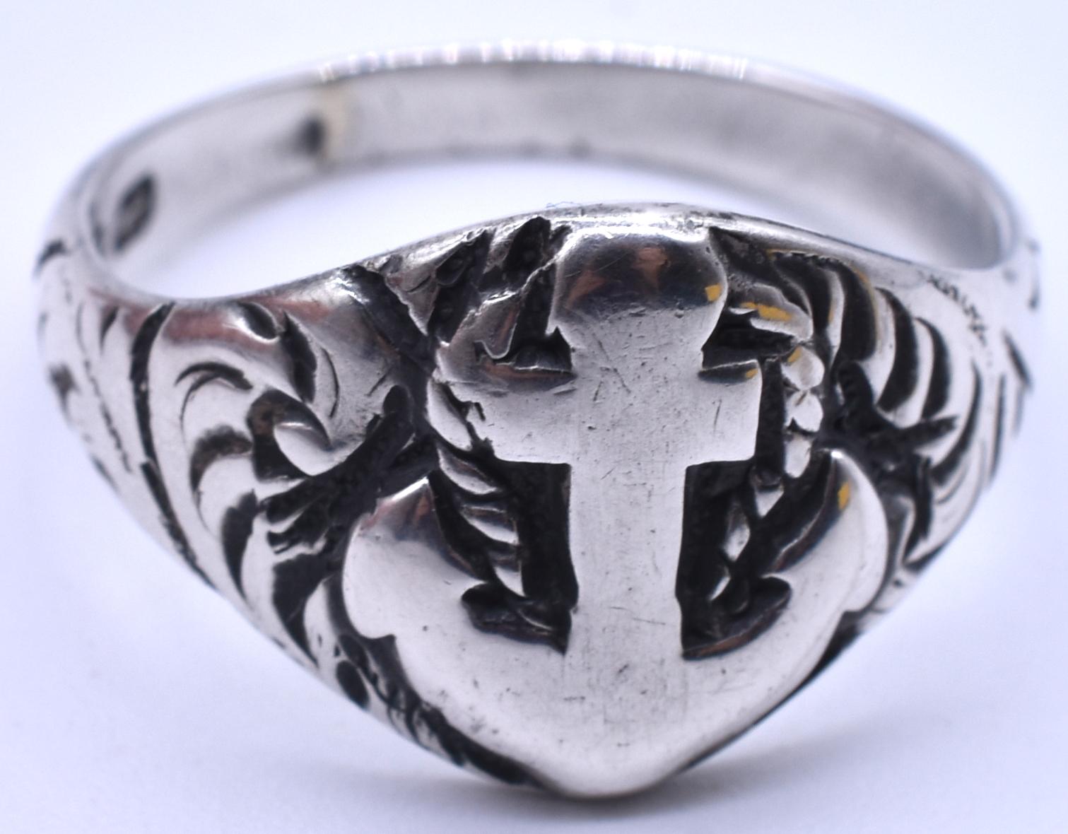 This substantial sterling silver ring has an anchor emblem at the center, a Victorian symbol of hope.  Appropriate for a man or woman and a well suited for a fisherman or sailor. Hallmarked Birmingham 1898, the ring is a size 8 3/4.