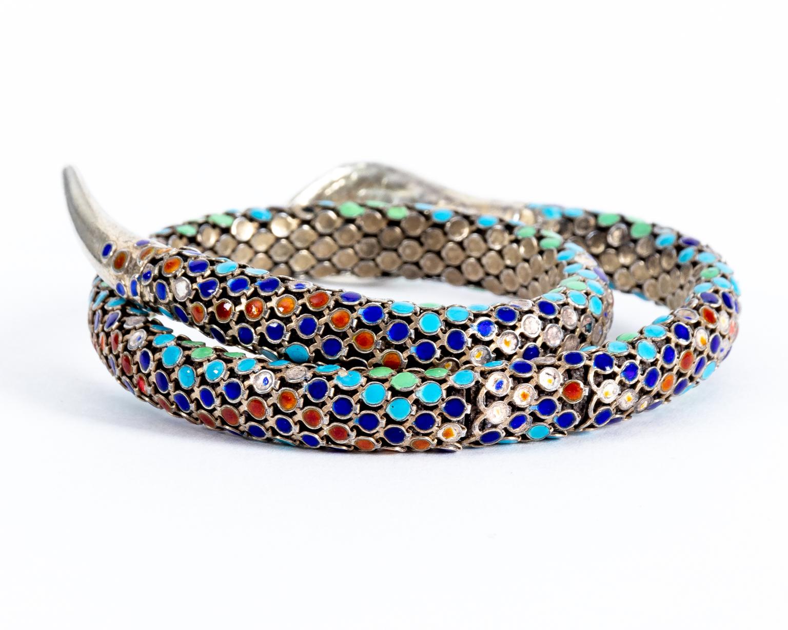 Circa 1920-30s Antique Art Deco enamel sterling silver coiled snake bracelet bypass rare. The piece wraps around and holds onto the forearm with the body and tail while the head sits on the arm slightly poised to strike. It is very well designed.