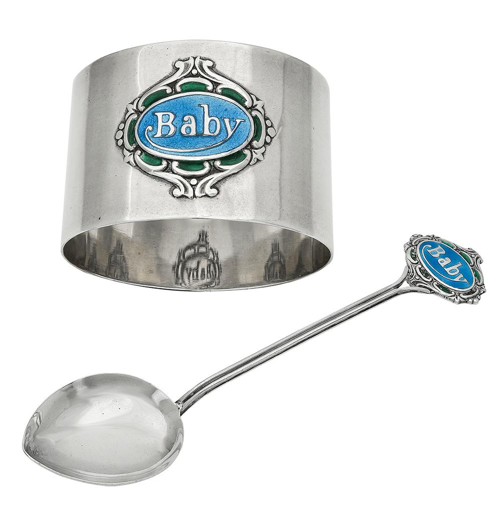 For the baby who has everything:  a sterling silver and enamel feeding spoon and napkin ring, in the original presentation box.  Made in Birmingham, 1906.  The spoon and napkin ring have applied cartouches, that are enameled in blue and green. 