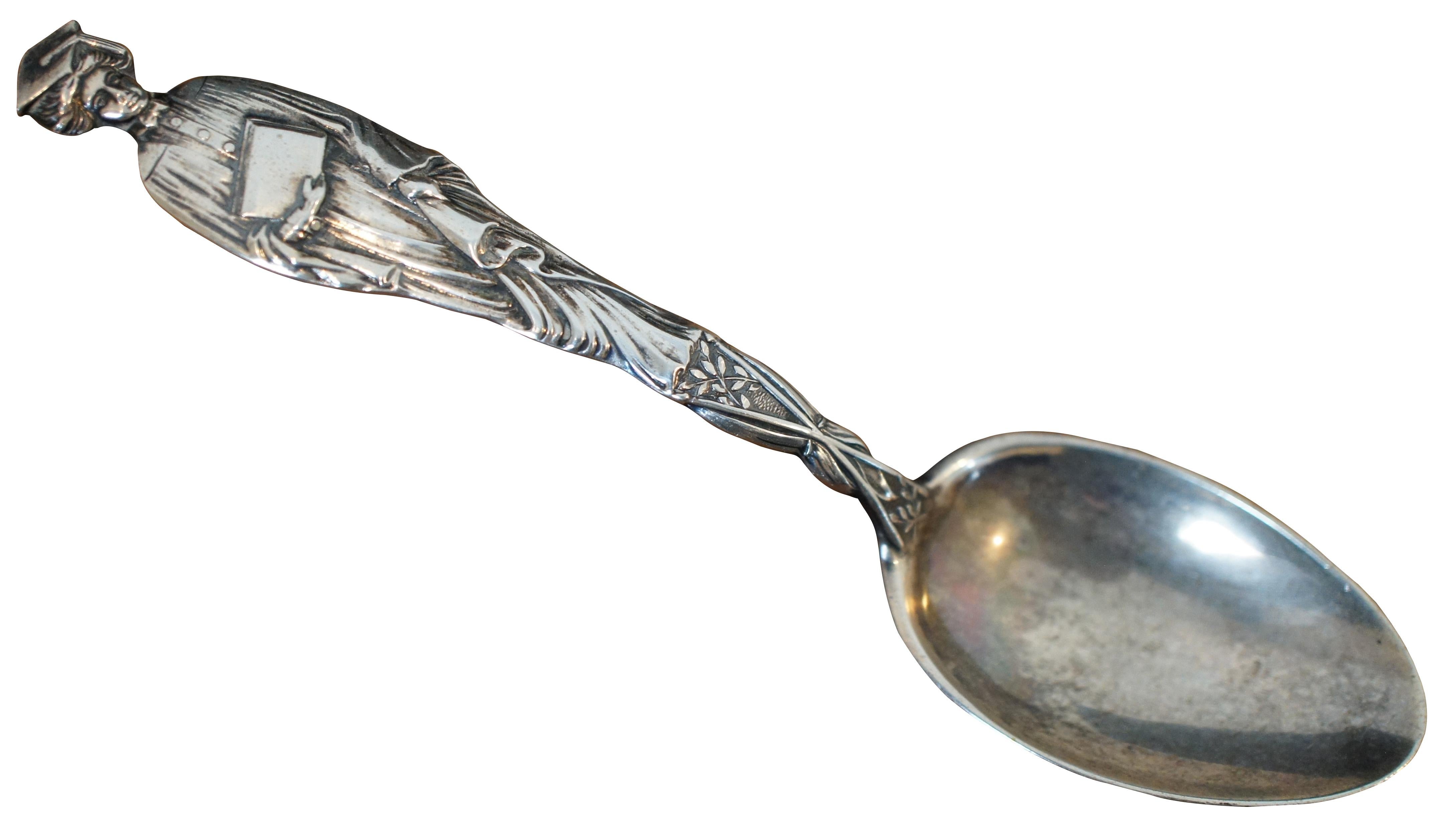 Antique late 19th century sterling silver spoon with a handle in the shape of a female college graduate holding her diploma, manufactured by the Mechanics Silver Co.

 