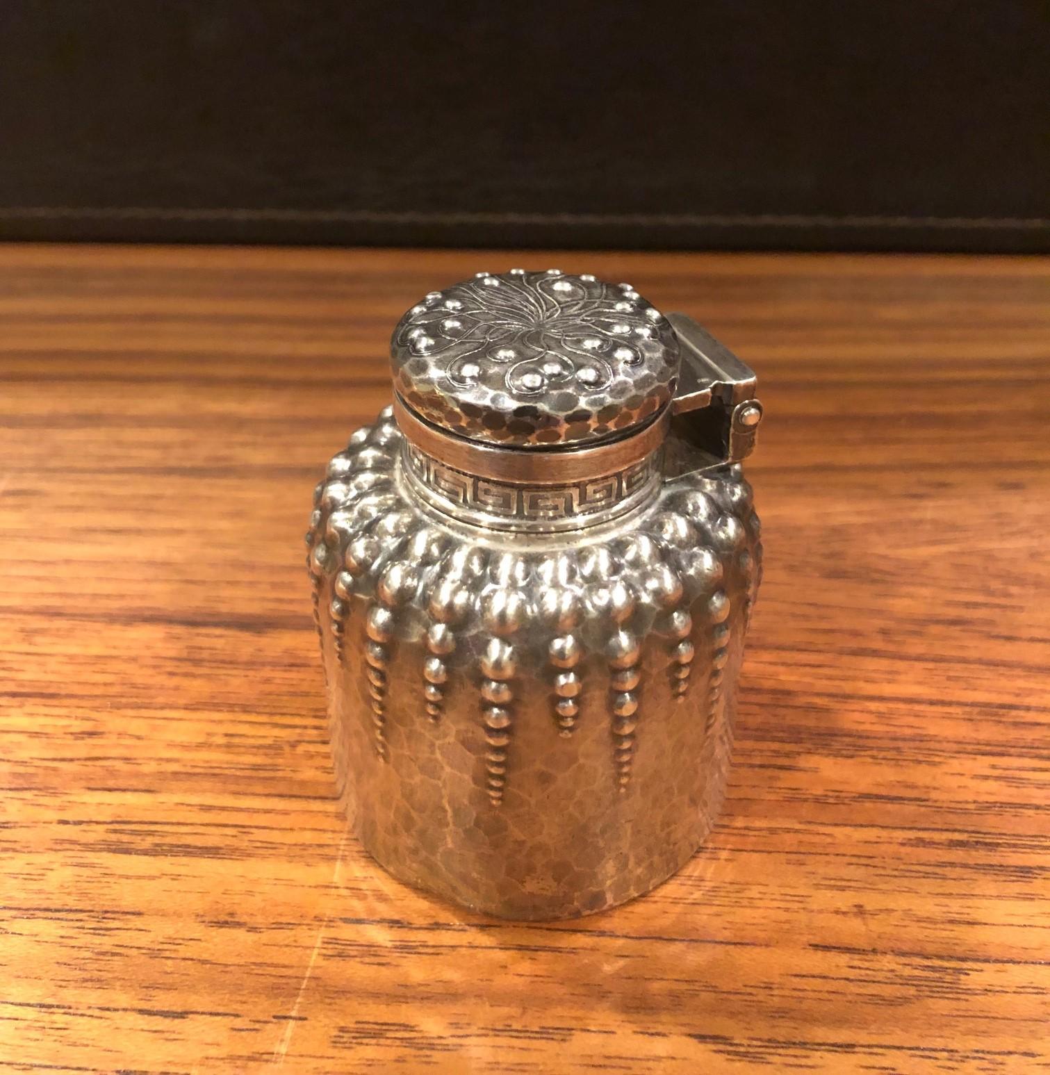 A very rare antique hand-hammered sterling silver inkwell by Tiffany & Co., circa 1880s. The piece was made between 1873-1891 and features a repousse pattern of bubbles. The inkwell has straight sides, curved shoulders, and threaded bun cap and the