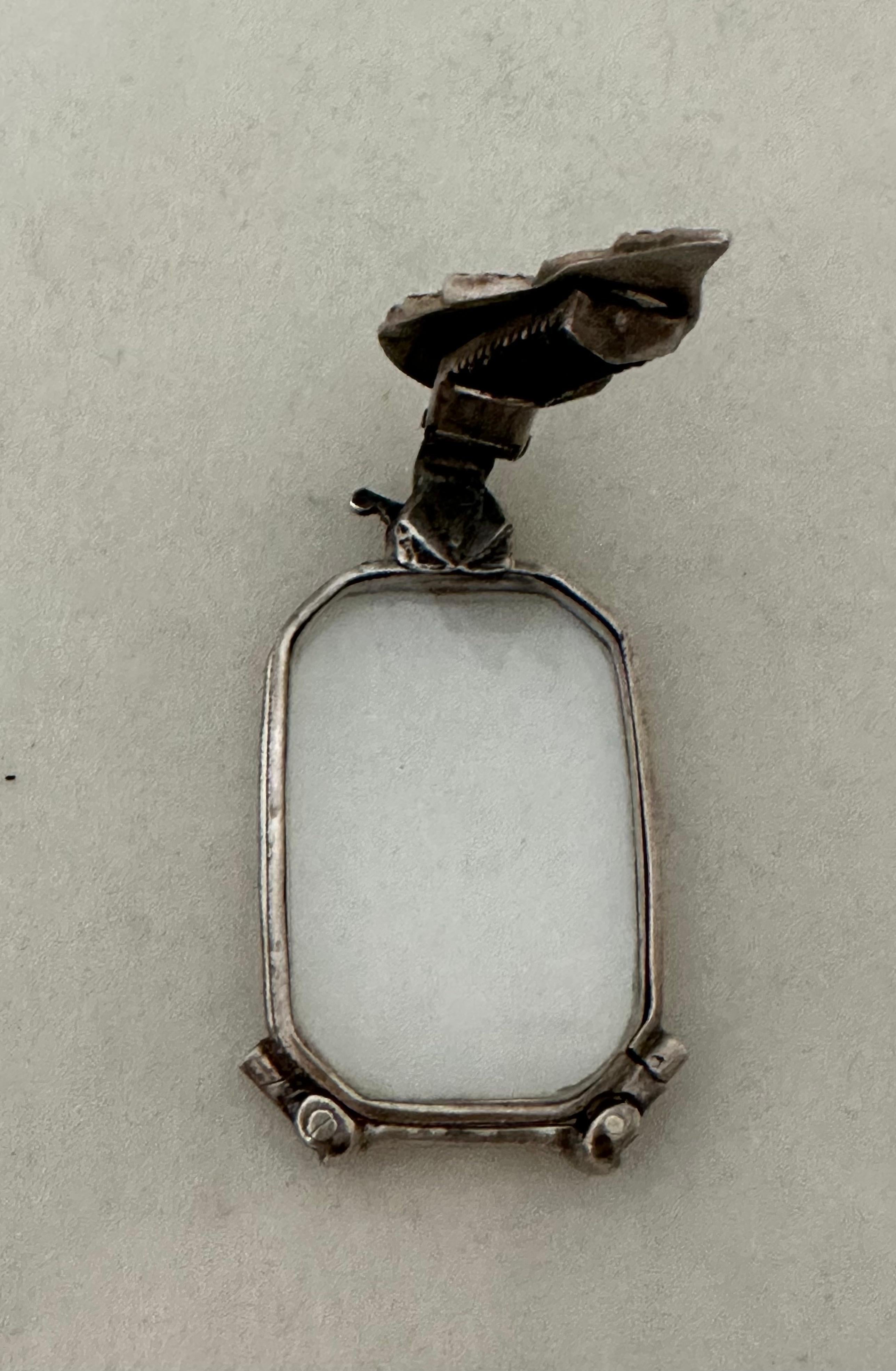 This vintage 20th century ladies “purse size” lorgnette is designed in silver with a stunning marcasite handle. The “hard to find” spectacles fold snugly into each other & “lock” into place. A collapsable sterling silver & marcasite leaf shape