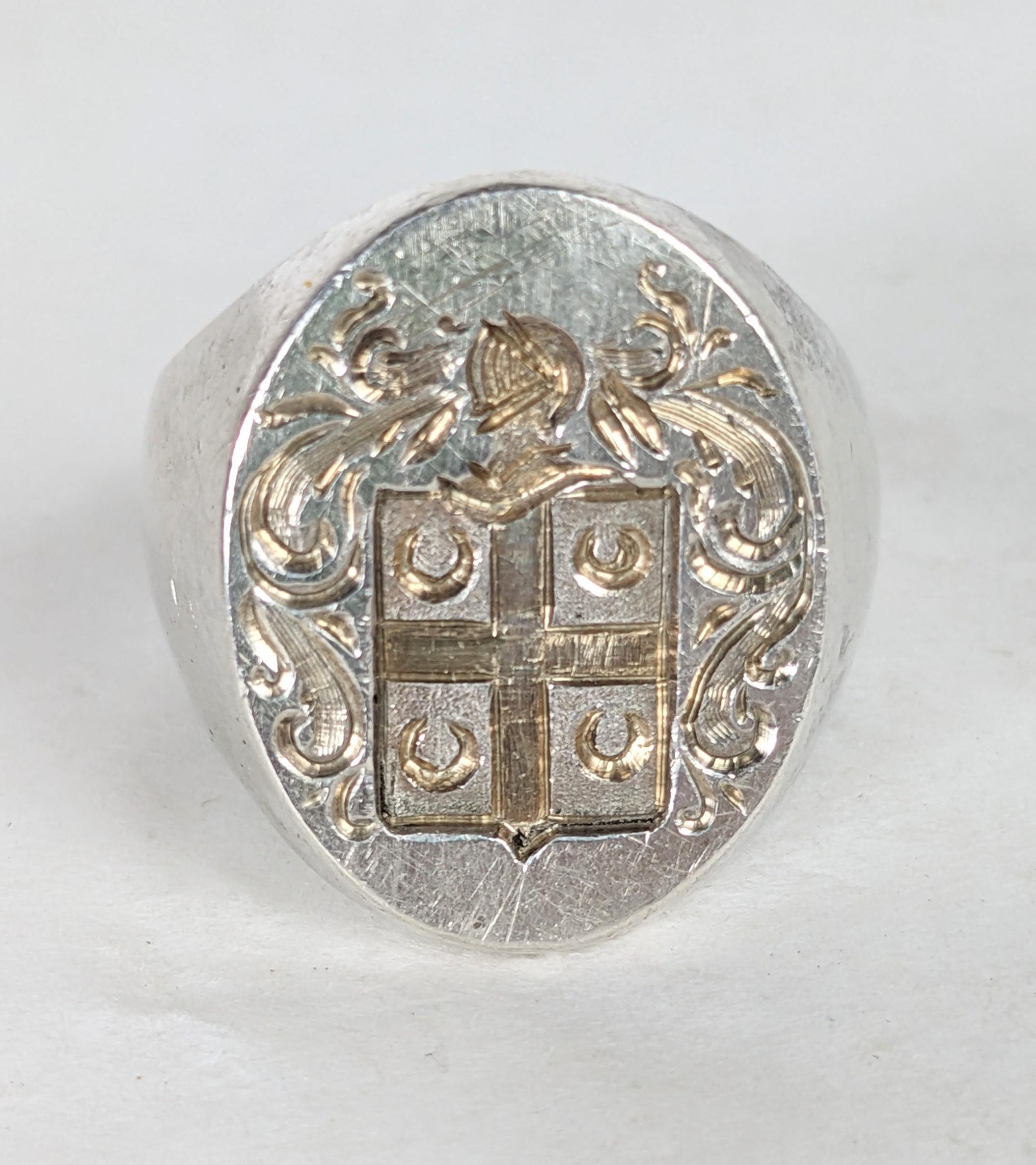 Massive Antique Sterling Signet Ring from the 1940's for instant old world vibes. Elegant armorial crest design which is crisp and unscratched. Super heavy quality sterling shank. Large imposing face measures 7/8