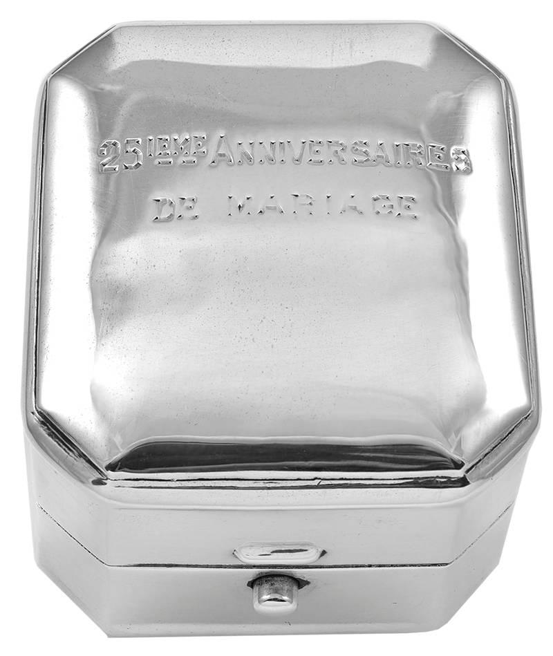 Sterling silver hinged ring box.  Engraved on the lid:  