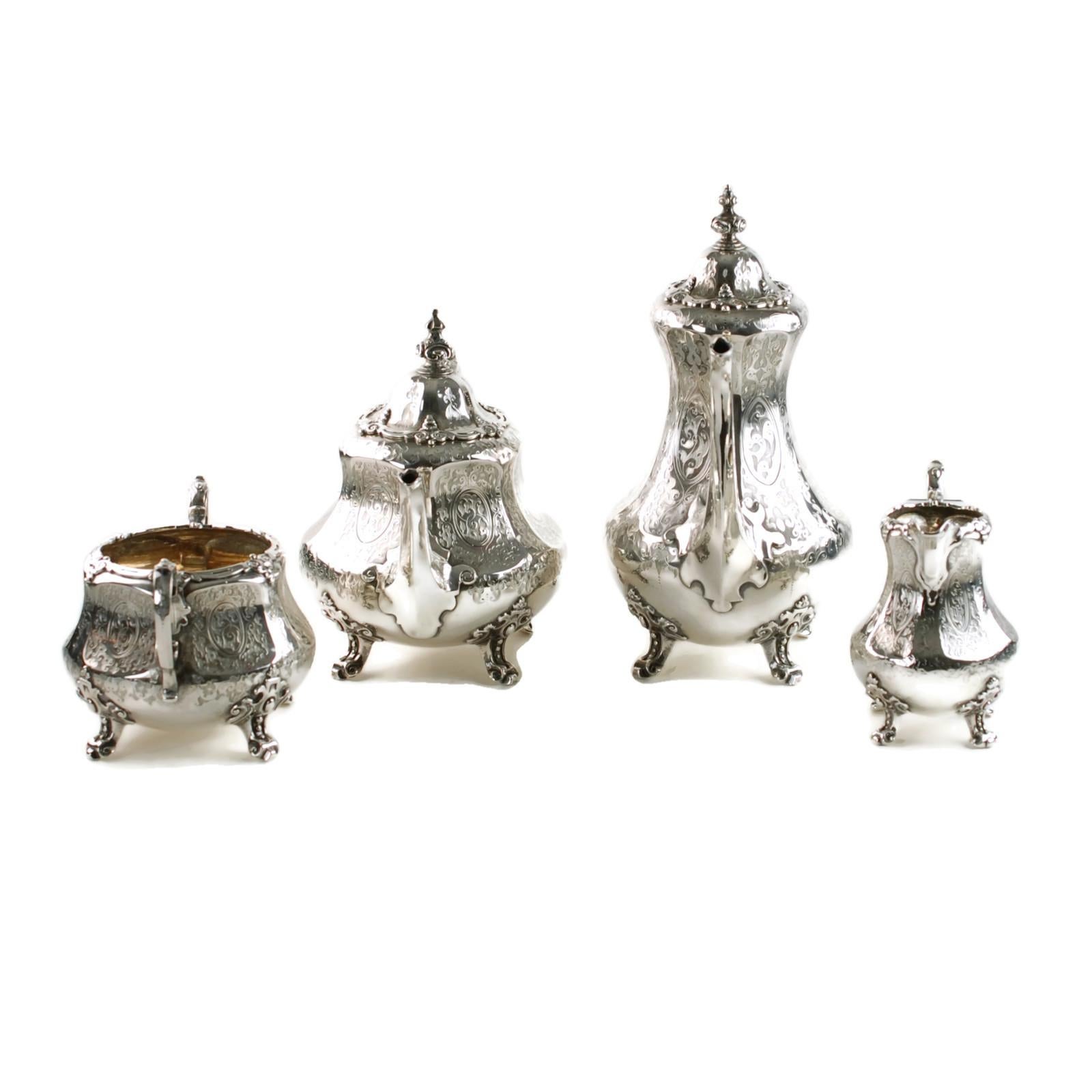 This antique Victorian solid sterling silver 4-piece tea and coffee set was made in 1863 by London silversmiths Daniel & Charles Houle. The set is comprised of a coffee pot, a teapot, a sugar bowl and a cream jug, each of which has a pear-shaped