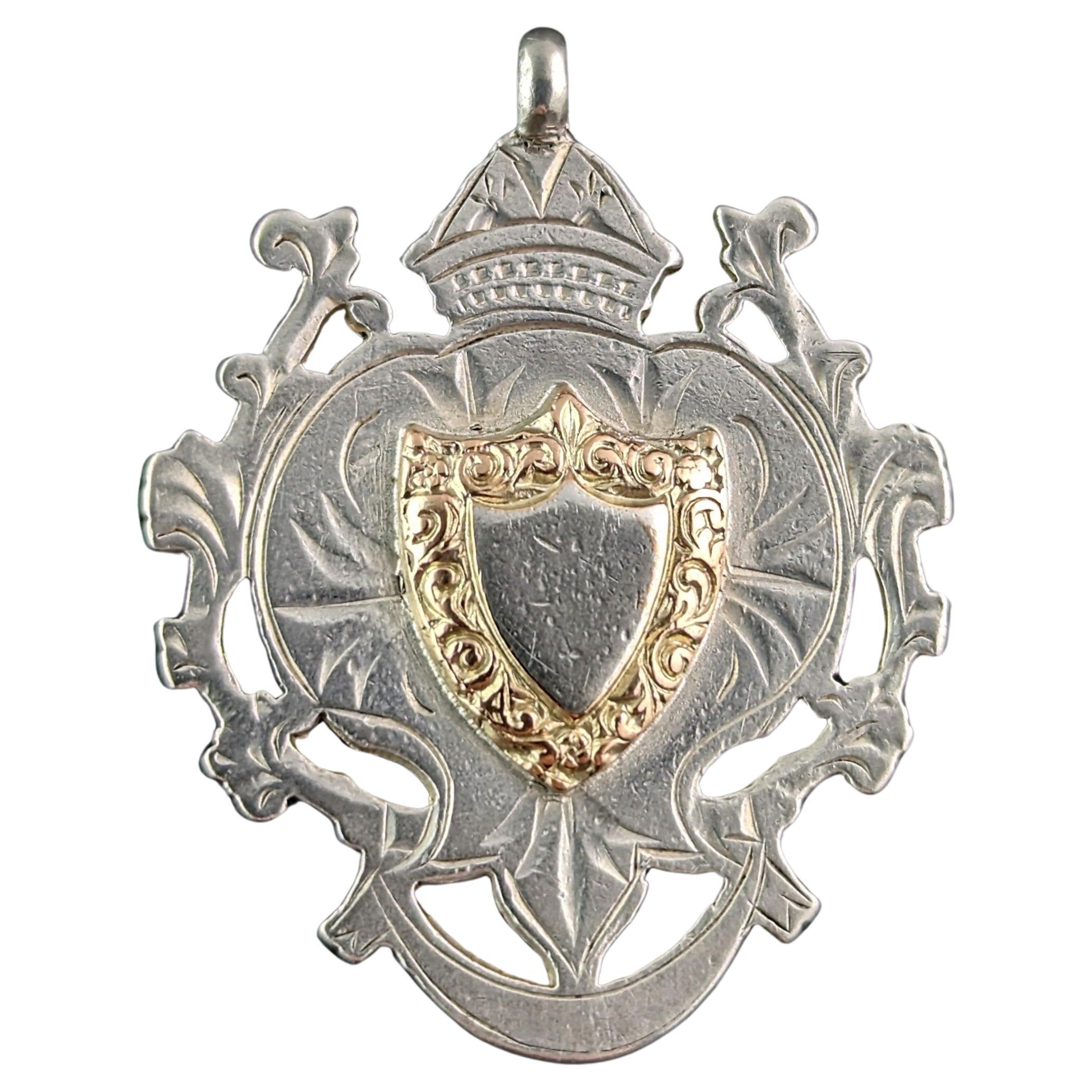 Antique sterling silver and 9k gold shield fob pendant 