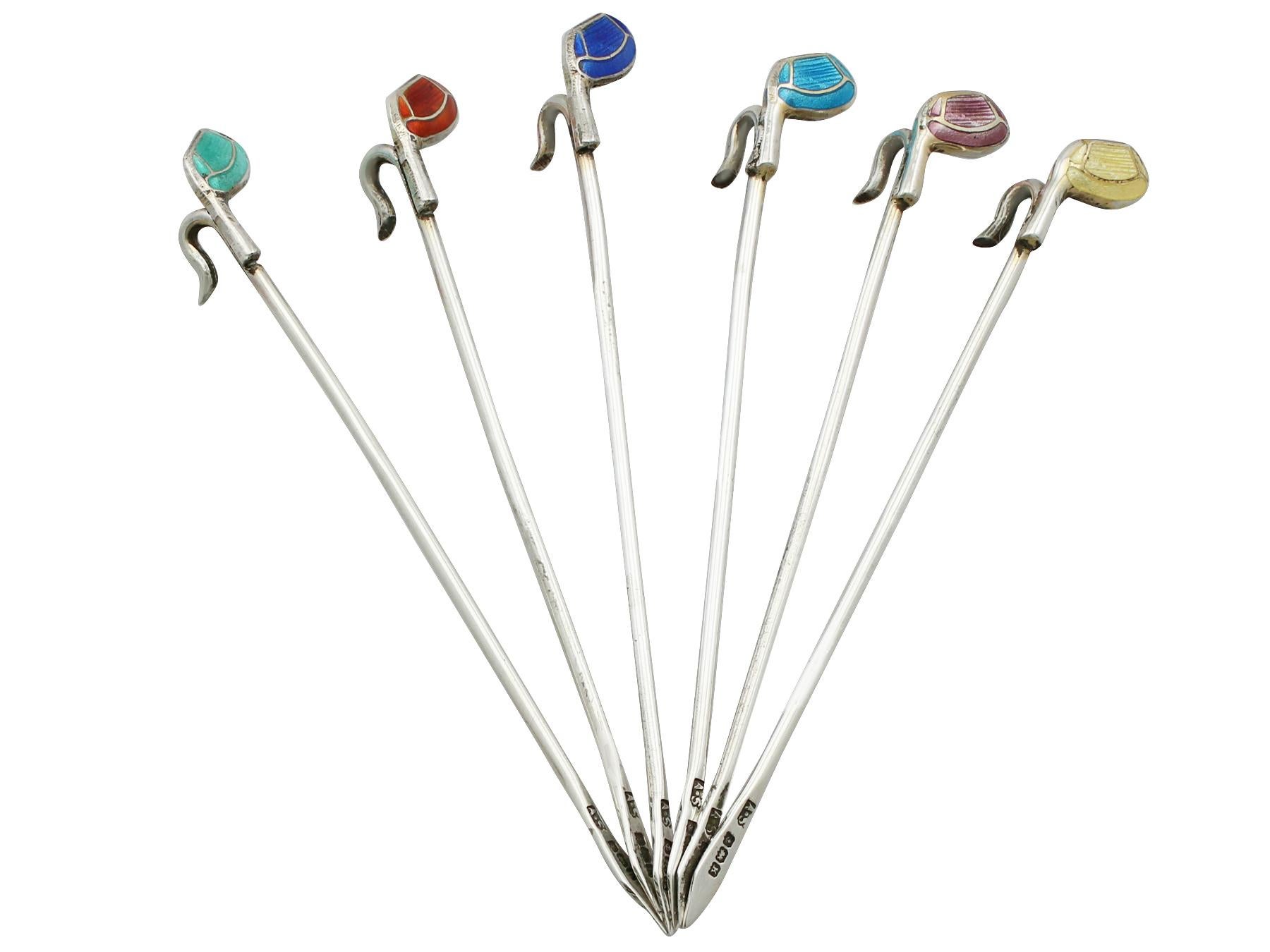 An exceptional, fine and impressive set of six antique George V English sterling silver and enamel cocktail sticks modelled in the form of golf clubs; an addition to our silverware collection.

These exceptional antique George V English sterling