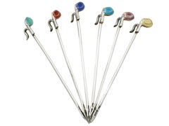 Palos de golf antiguos de plata de ley y esmalte