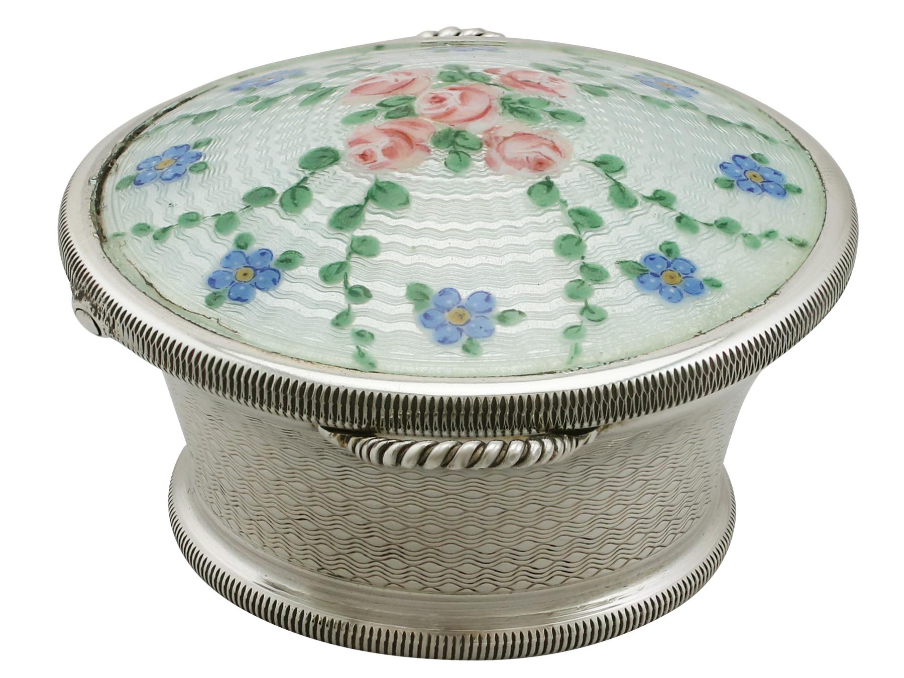 An exceptional, fine and impressive antique George V English sterling silver and enamel trinket box made by Levi and Salaman; an addition to the ornamental silverware collection.

This exceptional antique George V sterling silver box has a