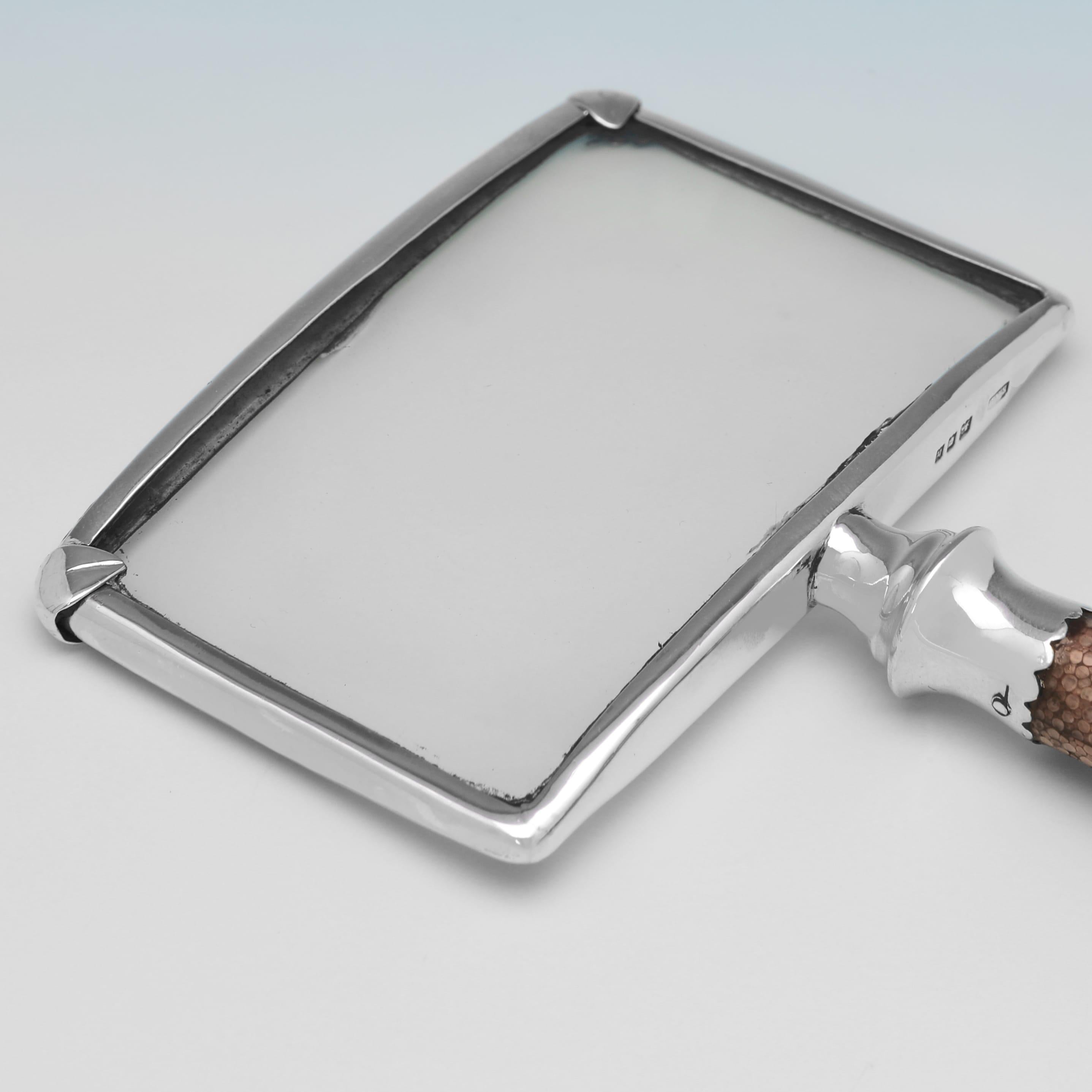 Hallmarked in London in 1923, this very handsome, George V period, Antique Sterling Silver Magnifying Glass, features a shagreen handle, and is plain in design. The magnifying glass measures 6.25