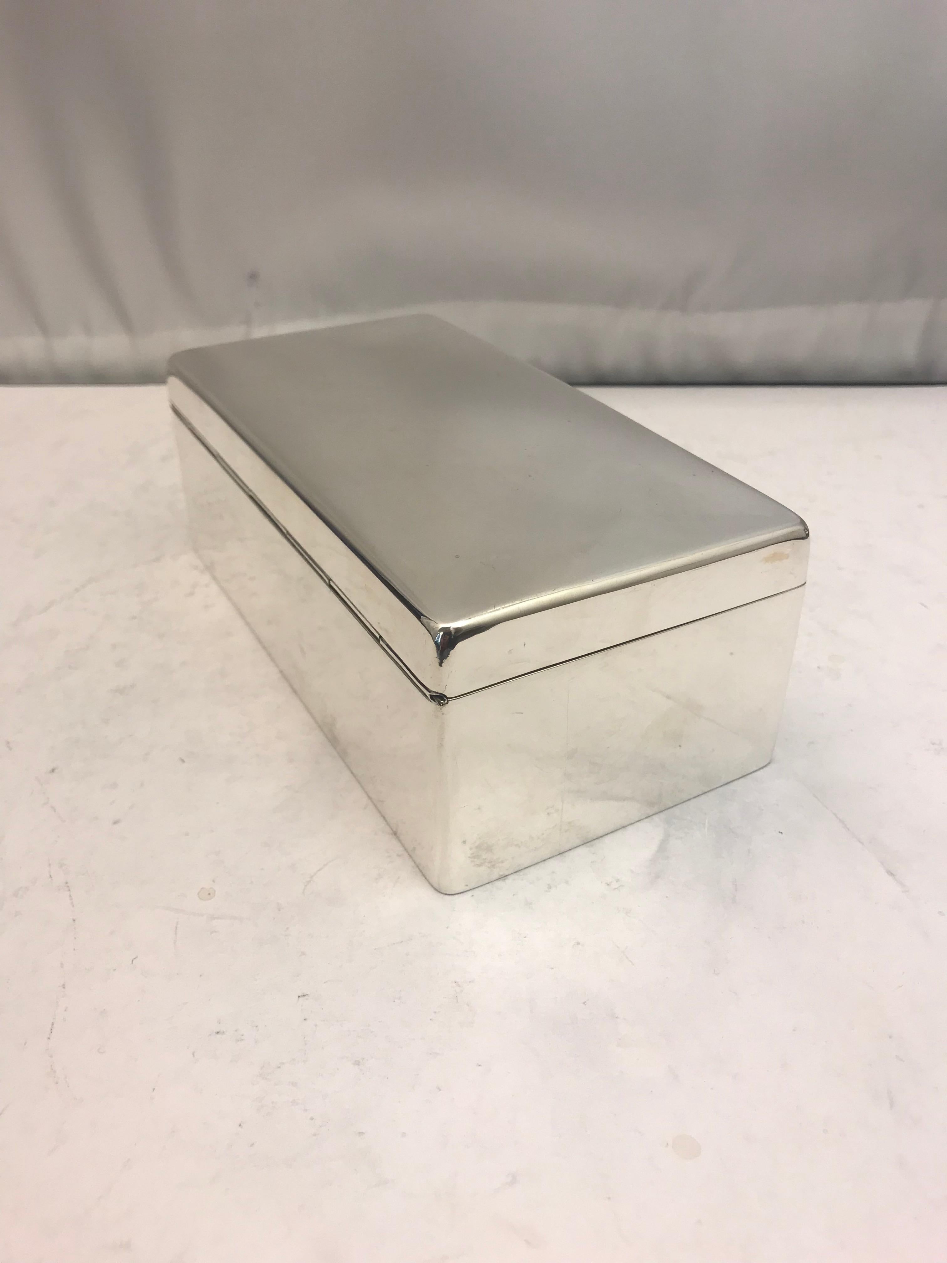 An antique plain style sterling silver box with a solid lid made by Zimmerman & Zimmerman, Birmingham 1908.