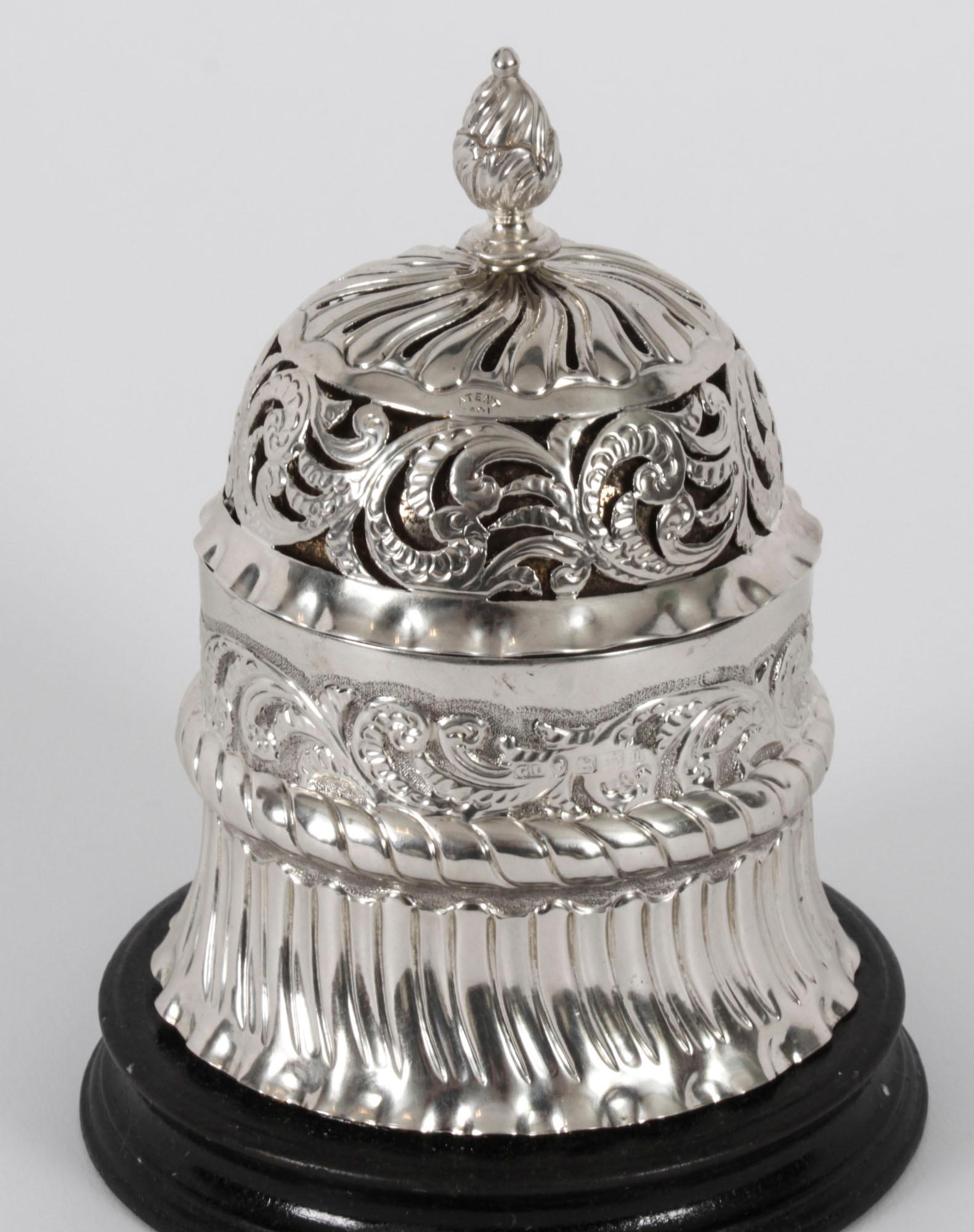 A delightful antique English Victorian sterling silver call bell, bearing the makers mark of the renowned silversmith George Unite and hallmarks for Birmingham 1888 and Patent 801.

Of domed circular form with pierced and repoussé foliate