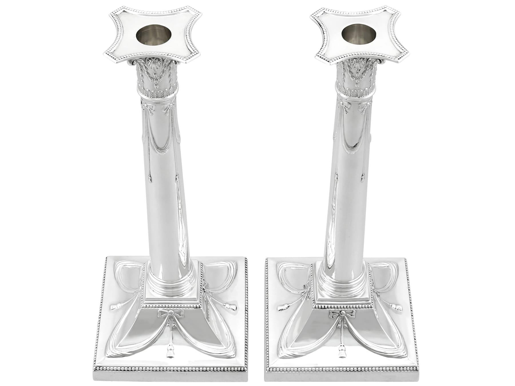 An exceptional, fine and impressive pair of antique George V English sterling silver candlesticks; an addition to our antique silverware collection

These exceptional, fine and impressive antique George V sterling silver candlesticks have a