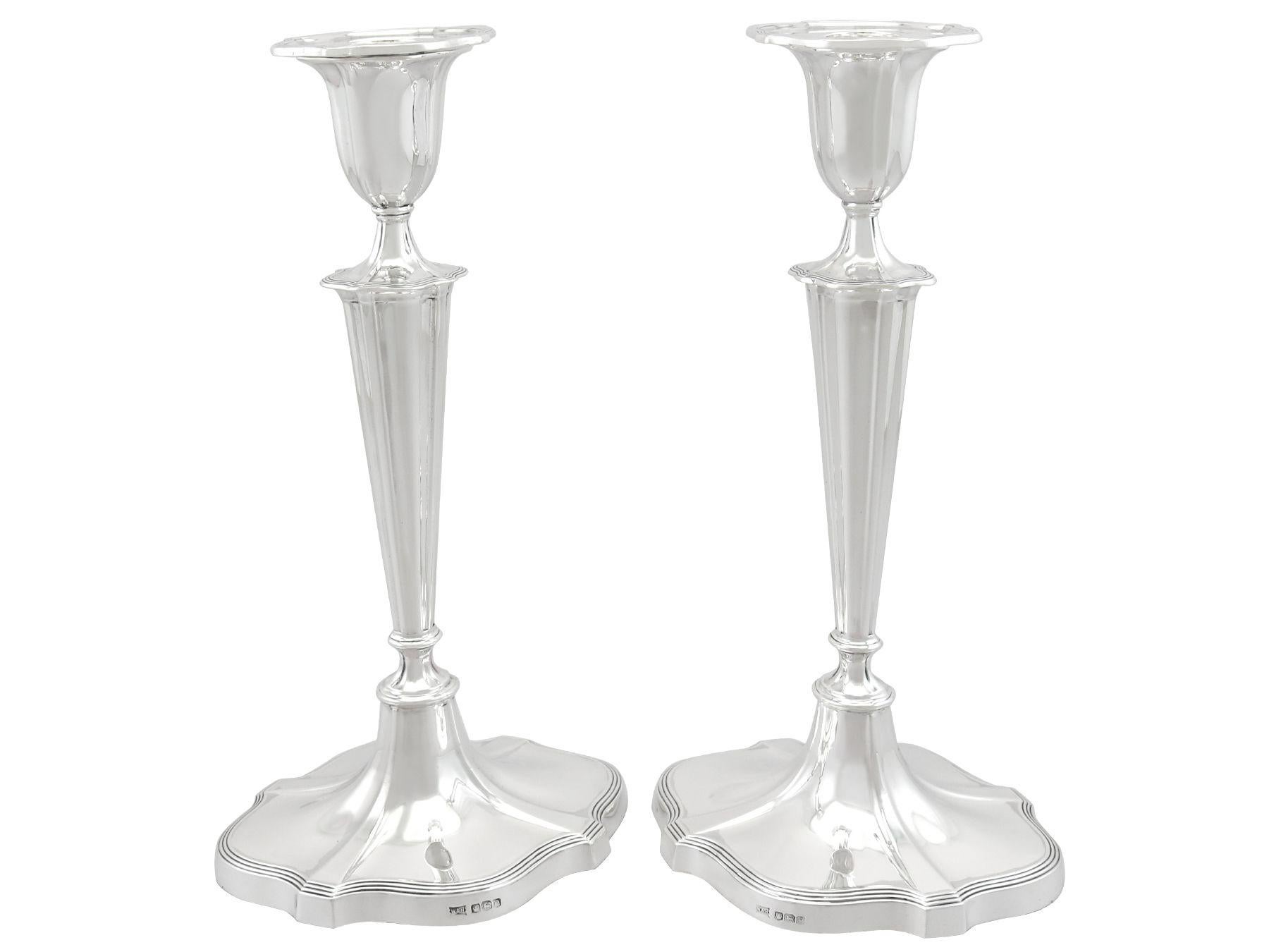 An exceptional, fine and impressive pair of large antique George V English sterling silver candlesticks; an addition to our antique silverware collection.

These exceptional, fine and impressive large antique George V sterling silver candlesticks