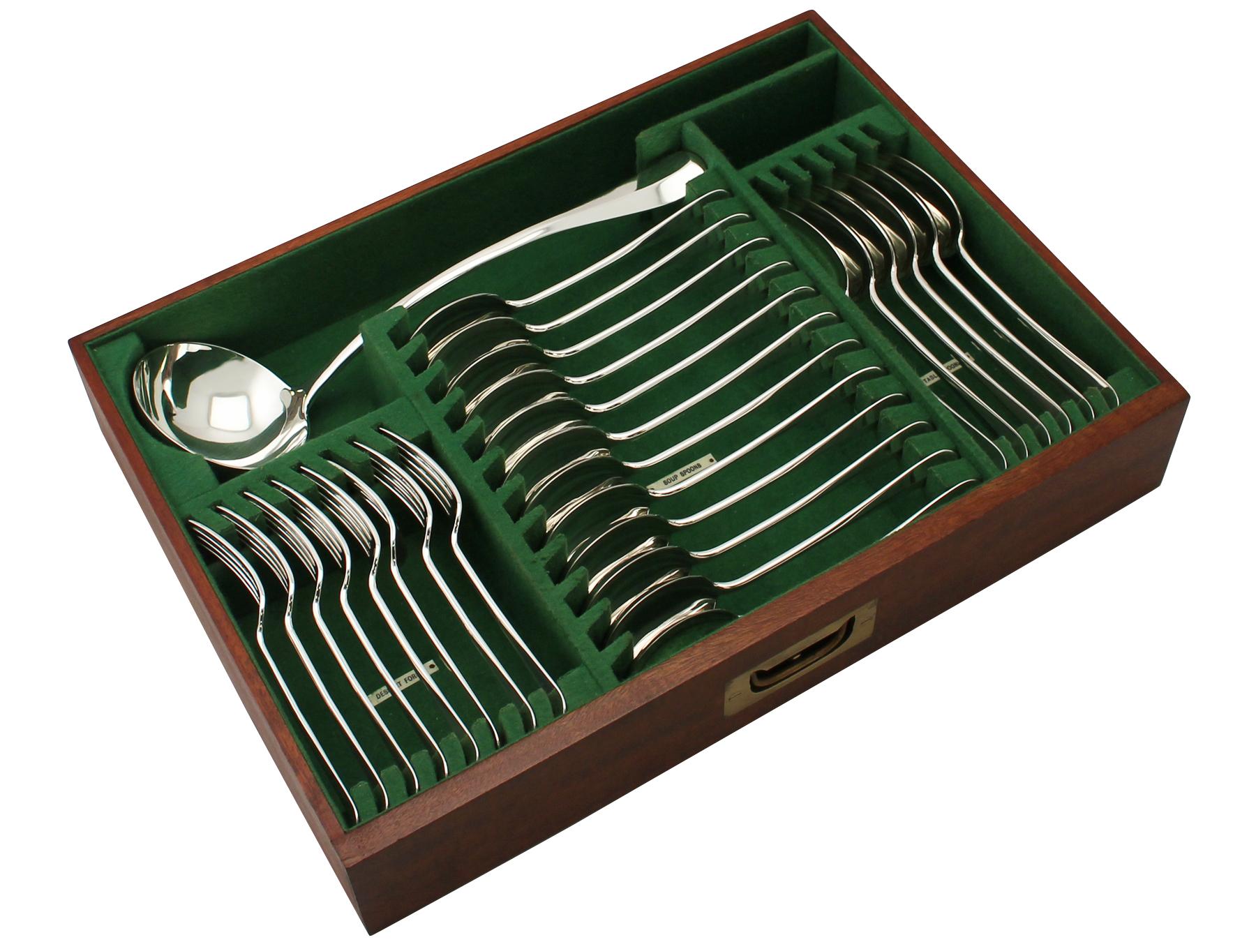 An exceptional, fine and impressive antique English sterling silver Hanoverian Rat Tail pattern flatware service for twelve persons - boxed; an addition to our canteen of cutlery collection.

The pieces of this impressive, antique sterling silver