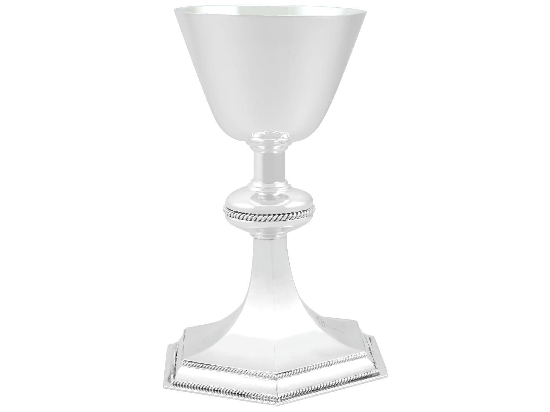 An exceptional, fine and impressive vintage George VI English sterling silver chalice; an addition to our religious silverware collection

This exceptional antique 1930's silver chalice, in sterling standard, has a circular bell-shaped form onto a