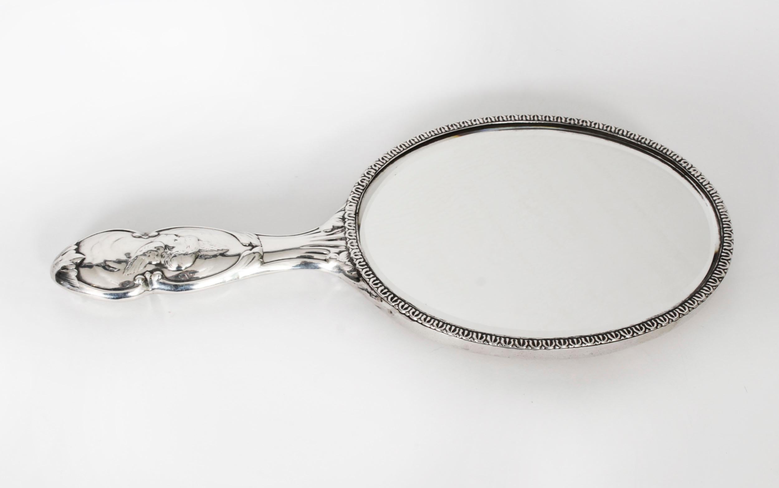 Early 20th Century Antique Sterling Silver Cherubs Hand Mirror 1905 William Comyns & Sons.