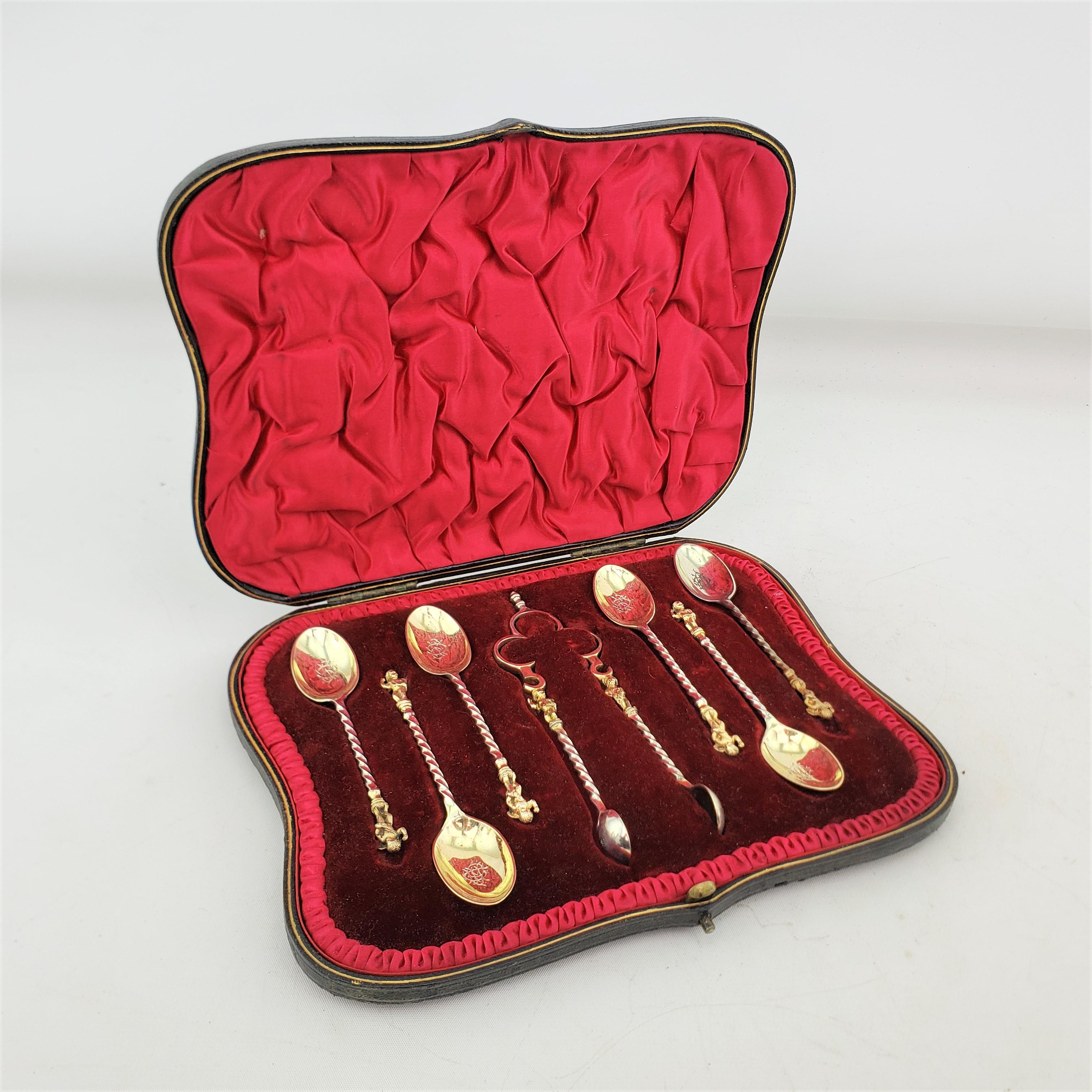 This antique tea of coffee spoon set was made by the Robert Stebbings silver firm of England in approximately 1900 in the period Edwardian style. The set is composed of six spoons and a set of sugar tongs made of sterling silver with a gold wash.