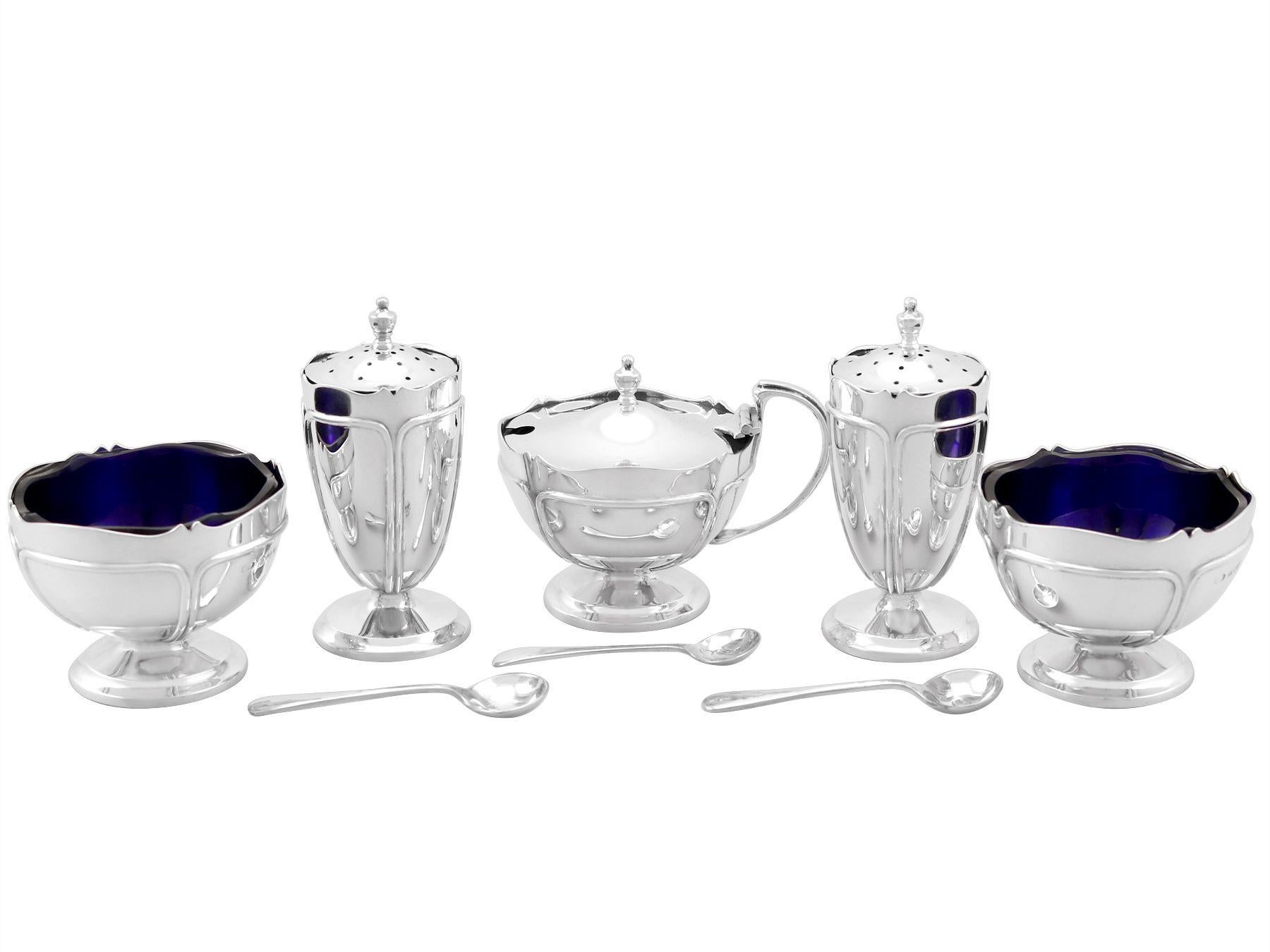 An exceptional, fine and impressive antique George V English sterling silver five piece condiment set - boxed; an addition to our dining silverware collection.

This exceptional 5 piece antique condiment set in sterling silver consists of two