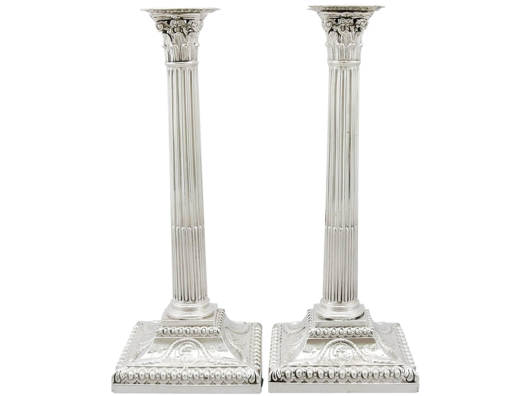 A fine and impressive pair of antique George III English sterling silver Corinthian column candlesticks; part of our ornamental Georgian silverware collection.

These exceptional antique George III sterling silver candlesticks have Corinthian