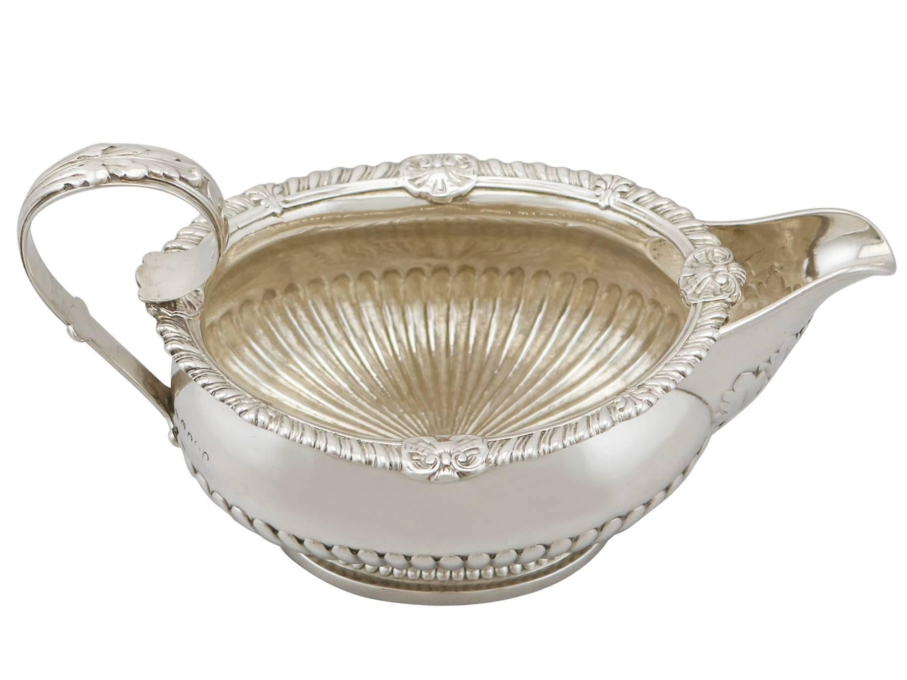 An exceptional, fine and impressive antique George III English sterling silver cream jug made by Paul Storr; an addition to our Georgian silver teaware collection.

This exceptional antique George III sterling silver cream jug has an oval rounded